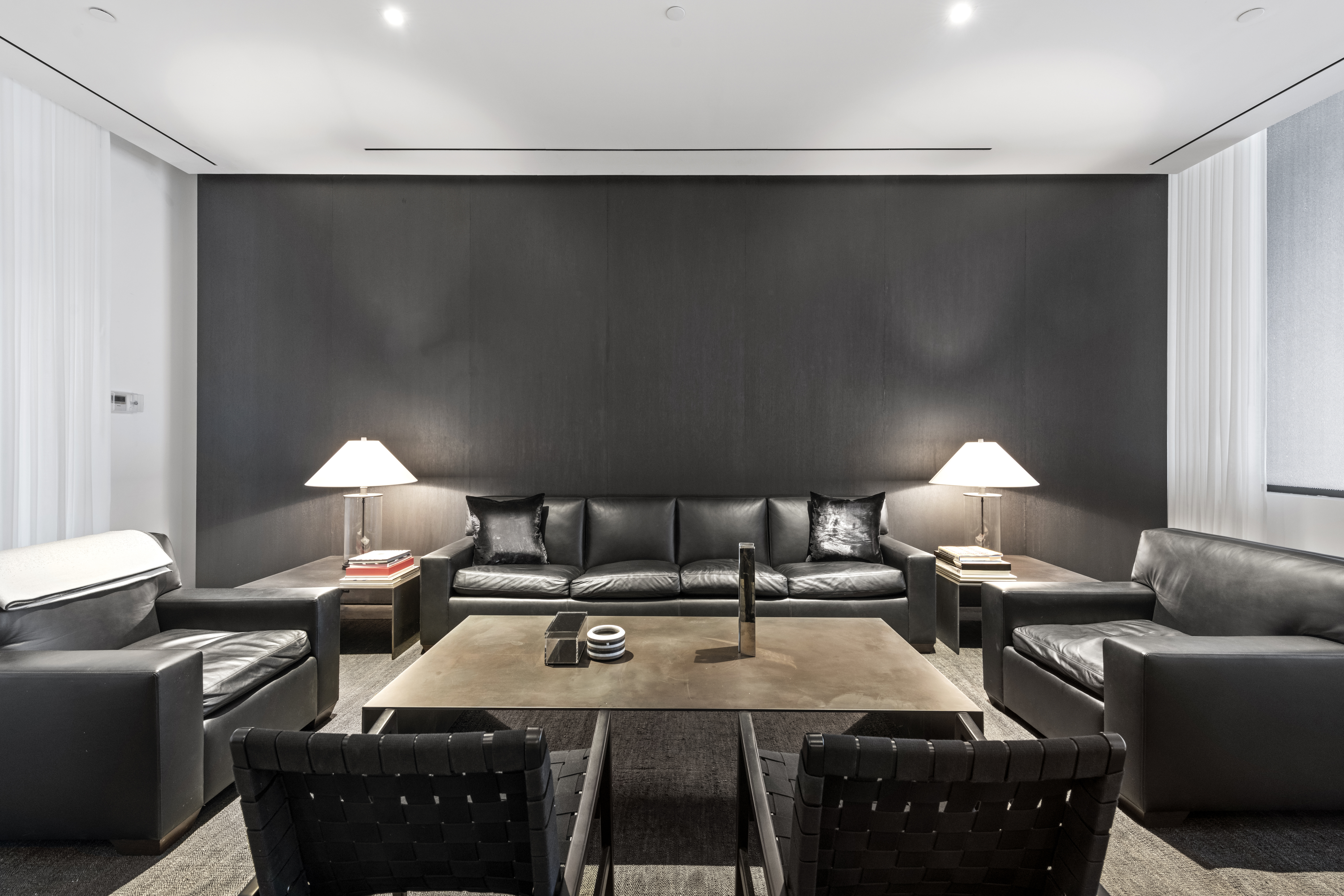 11 North Moore Street, Unit 2B Manhattan, NY 10013 - Photo 10 of 12 a living room with furniture a lamp and a flat screen tv