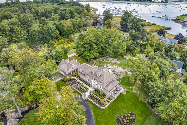 an aerial view of a house with a yard