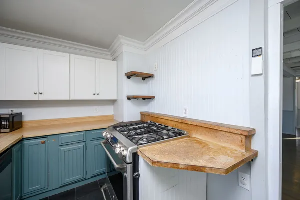 a kitchen with a sink and cabinets
