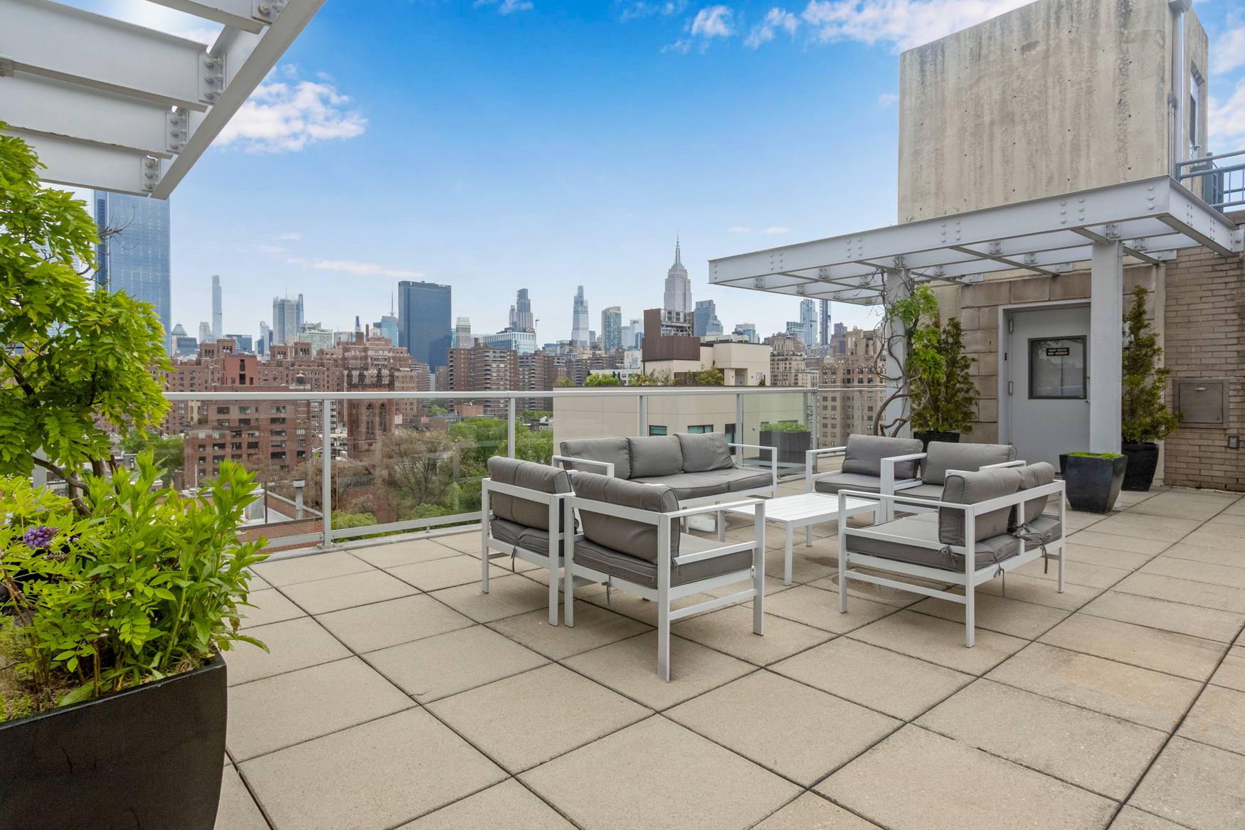 444 West 19th Street, Unit 701 Manhattan, NY 10011 - Photo 9 of 11 a view of a terrace with furniture and a potted plant