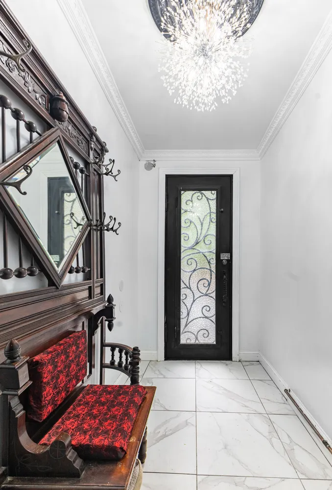 a living room with furniture and a painting