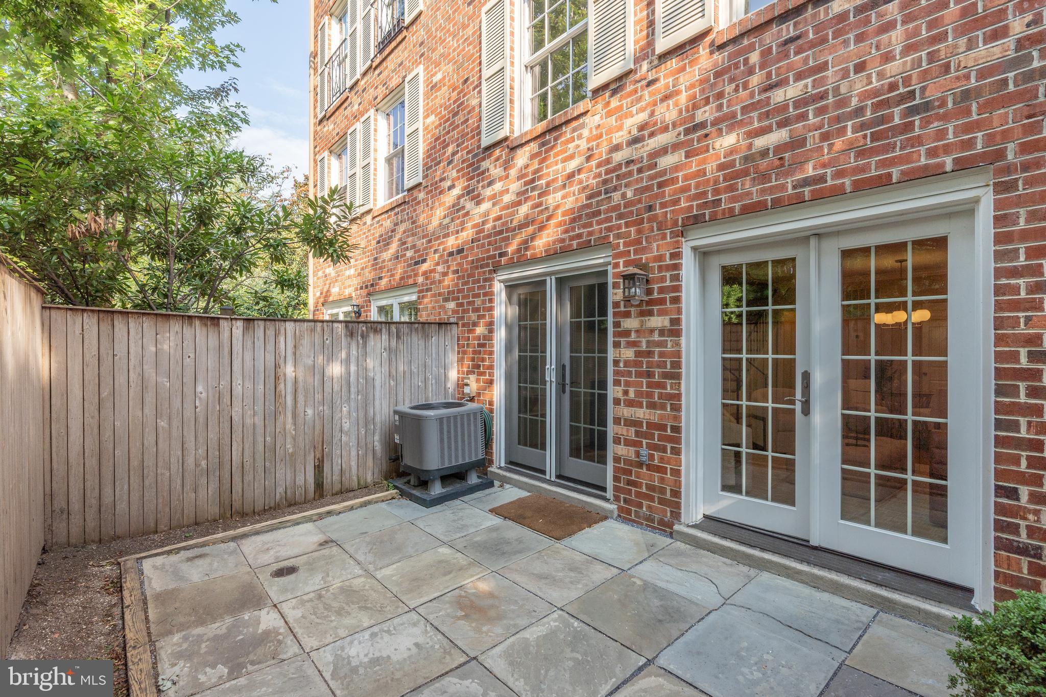 3299 Sutton Place Northwest, Unit C Washington, DC 20016 - Photo 9 of 41 a view of house with backyard and chair