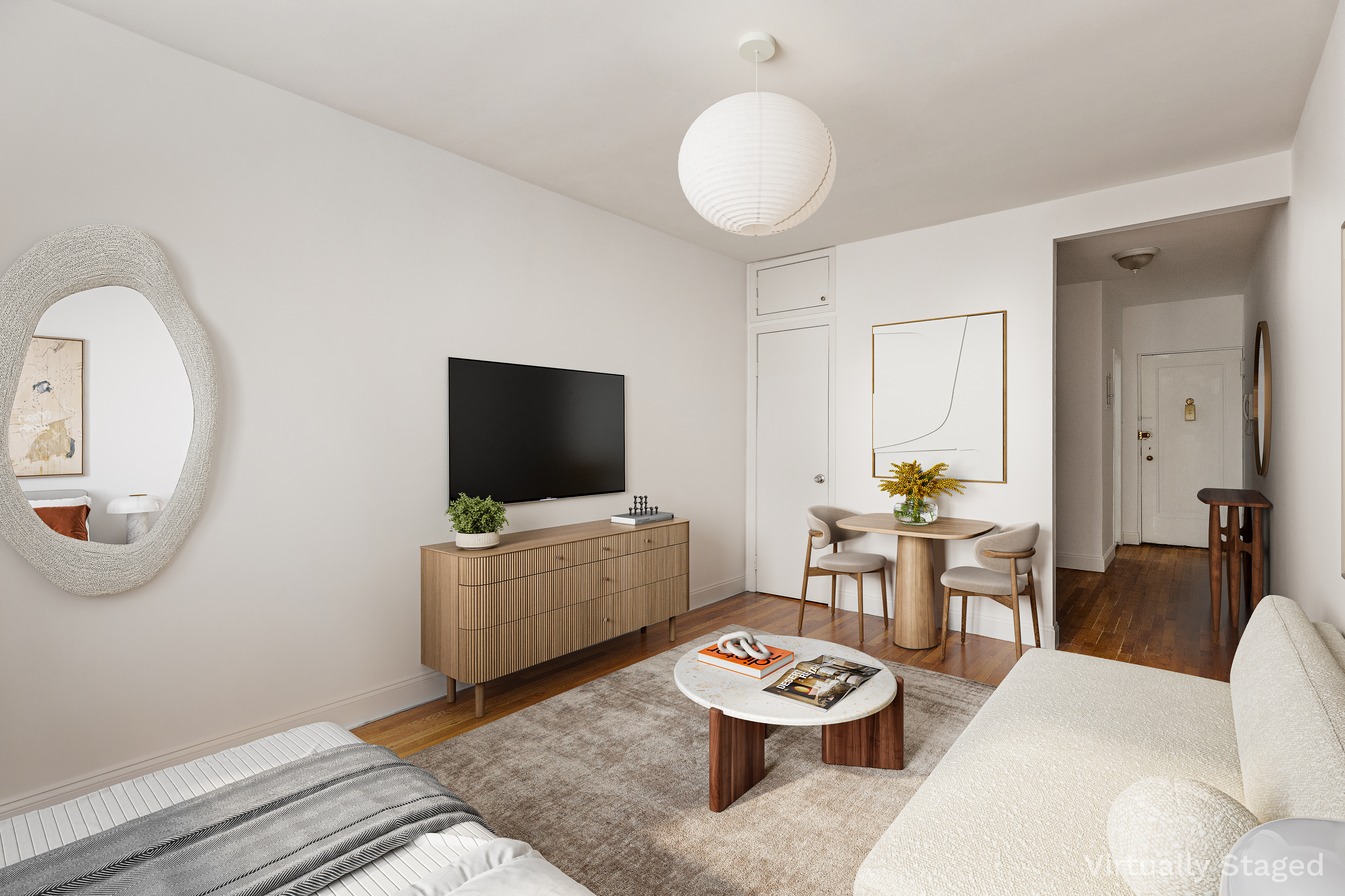 312 West 23rd Street, Unit 4G Manhattan, NY 10011 - Photo 3 of 12 a living room with furniture and a flat screen tv