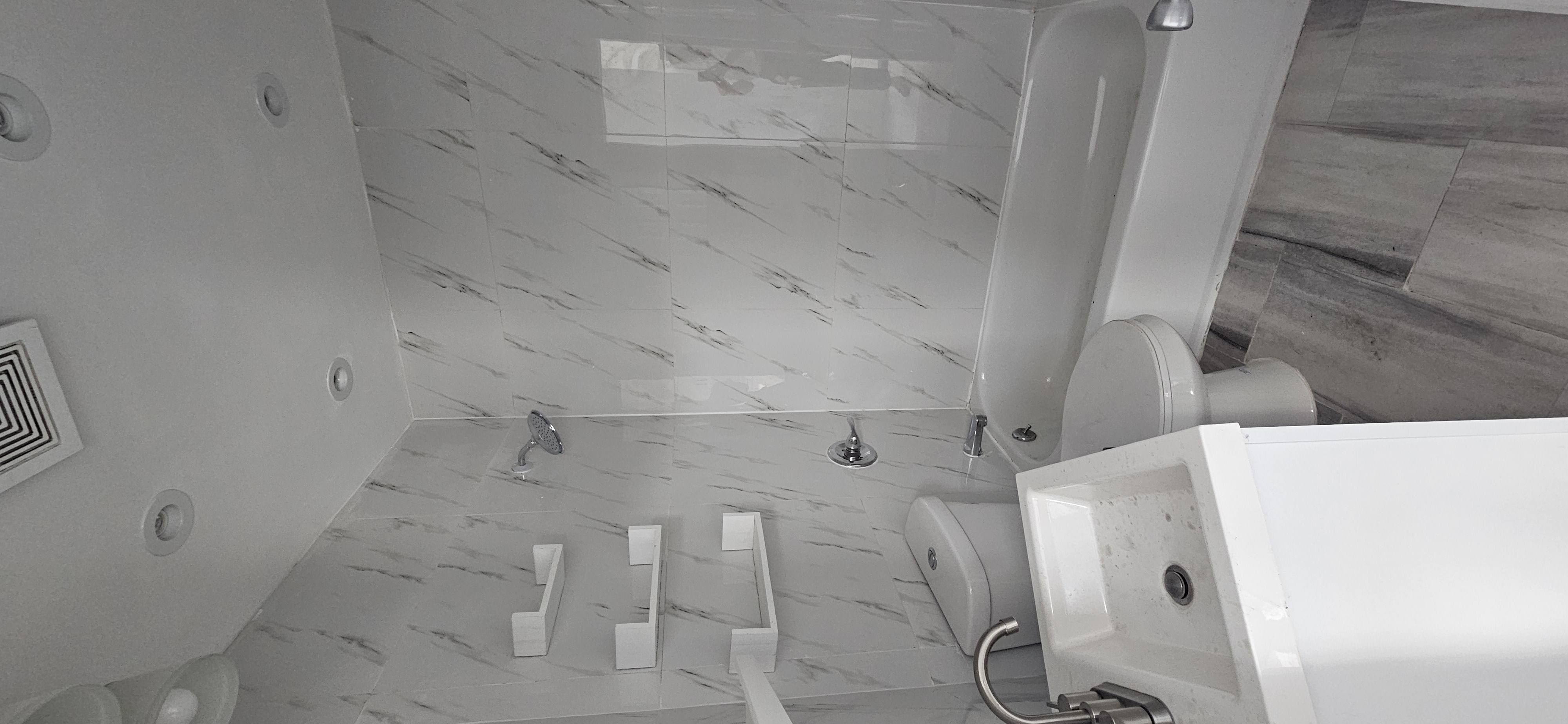 2610 Atlantic Avenue, Unit 3 Brooklyn, NY 11207 - Photo 3 of 5 a bathroom with a sink a toilet and shower