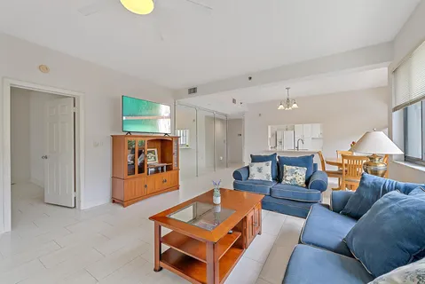 a living room with furniture and a table