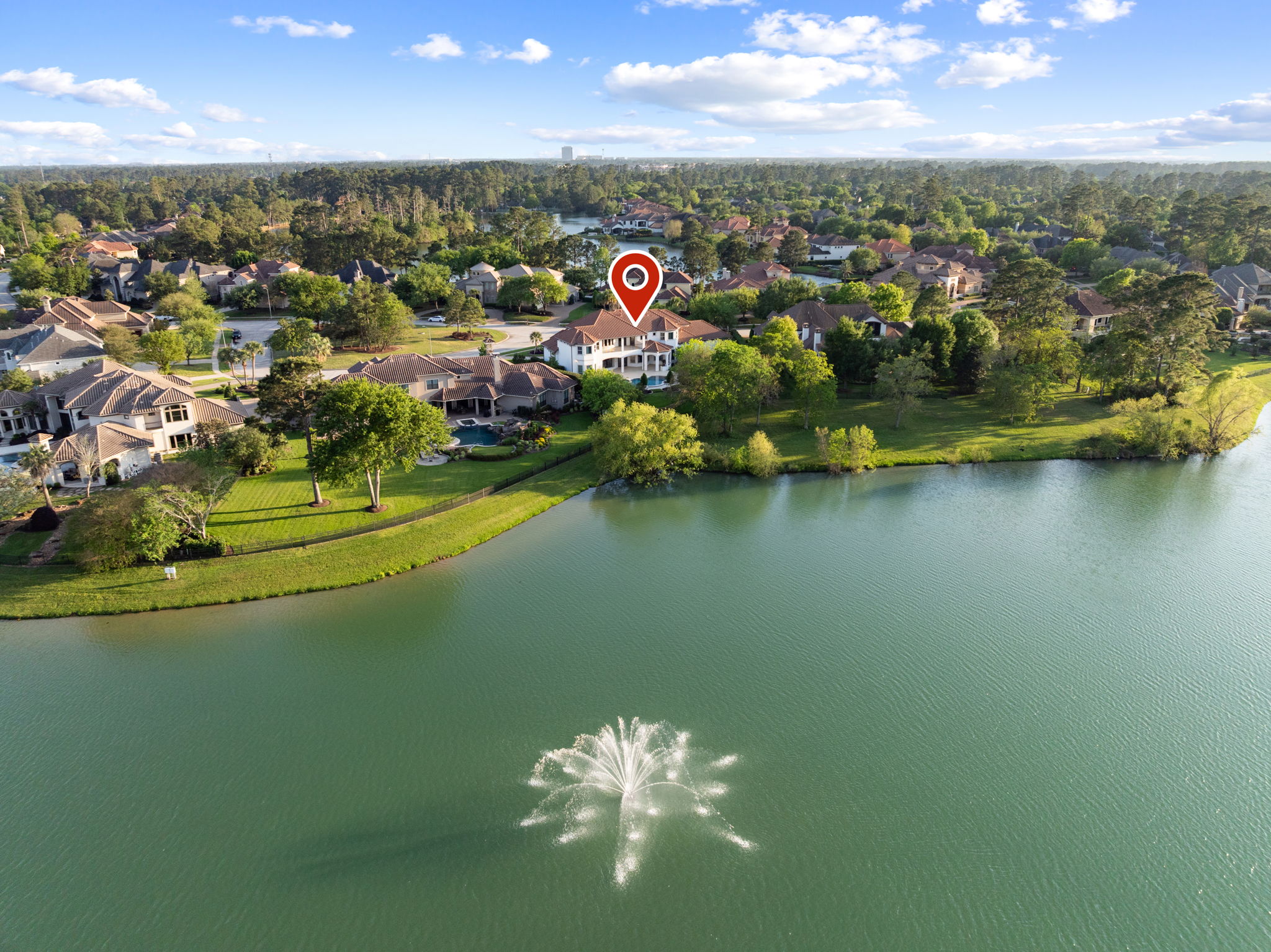 82 Manor Lake Estates Circle Spring, TX 77379 - Photo 4 of 52 an aerial view of residential houses with outdoor space and lake view