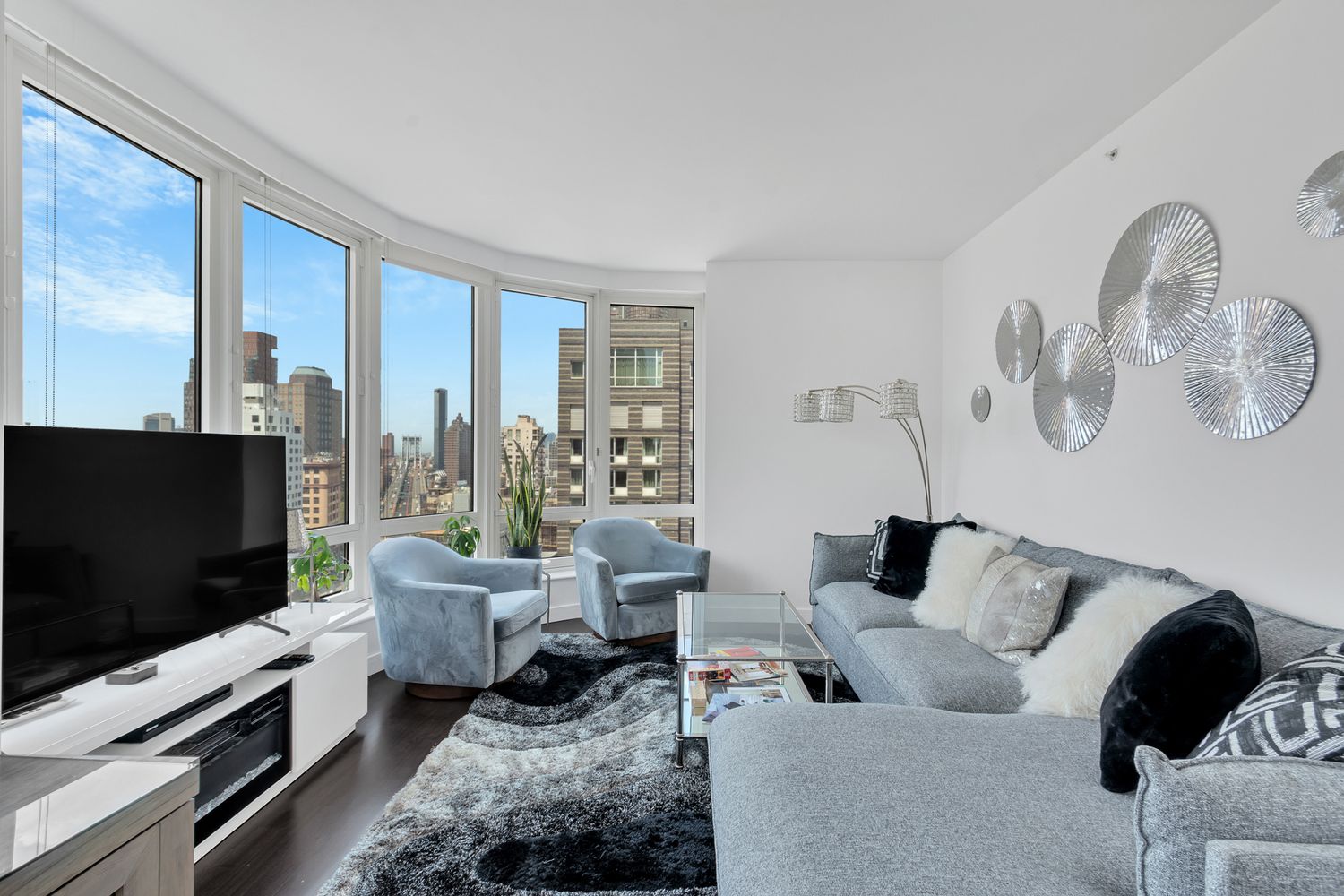 a living room with furniture and a flat screen tv