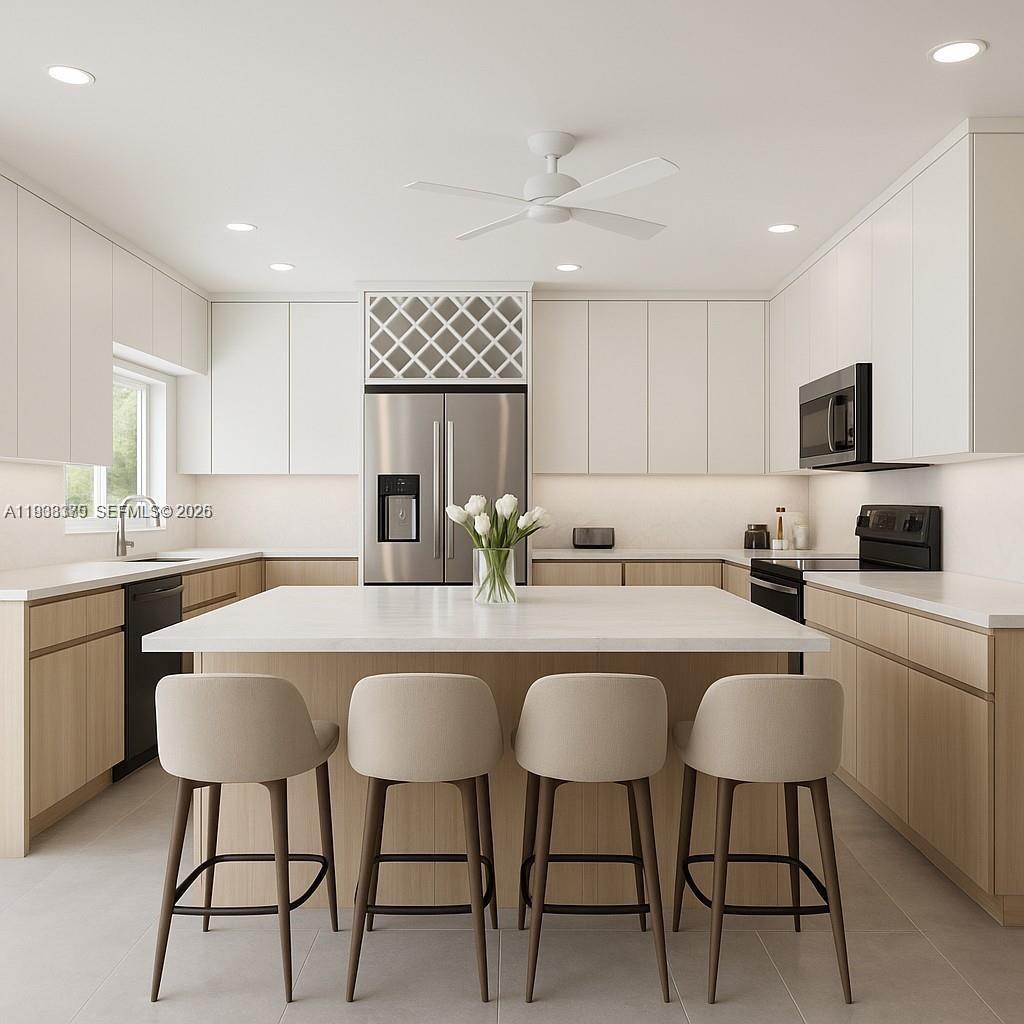 a kitchen with a sink and chairs