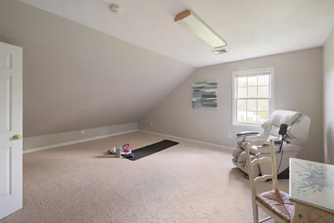 a room with furniture and white walls