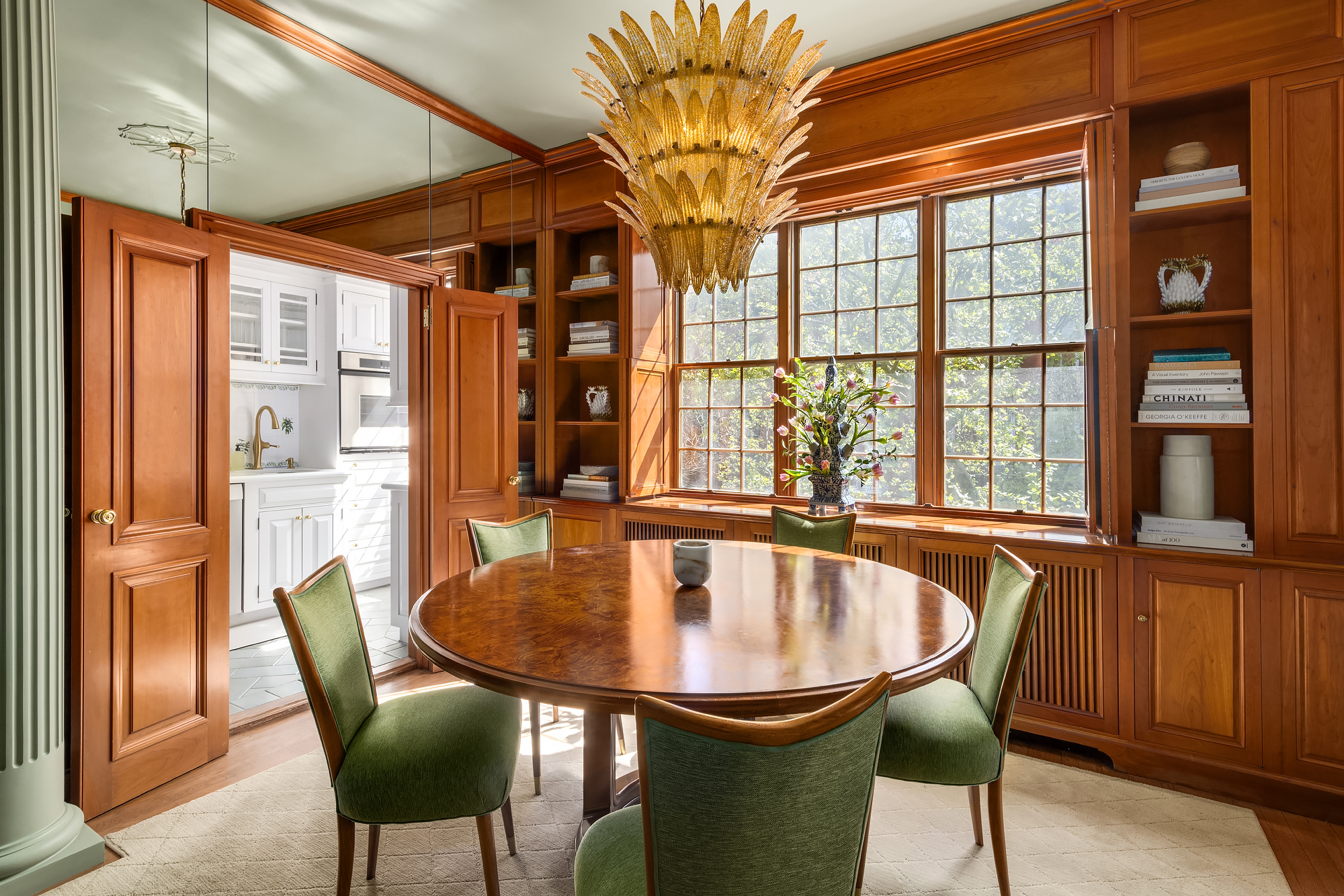 159 West 13th Street Manhattan, NY 10011 - Photo 23 of 36 a dining room with furniture a chandelier and wooden floor