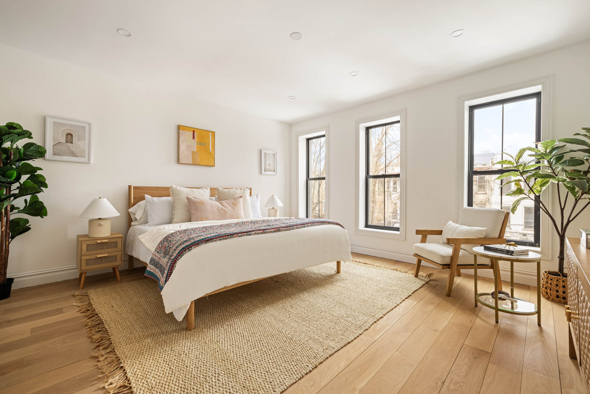 819 Greene Avenue Brooklyn, NY 11221 - Photo 7 of 14 a spacious bedroom with a bed and wooden floor