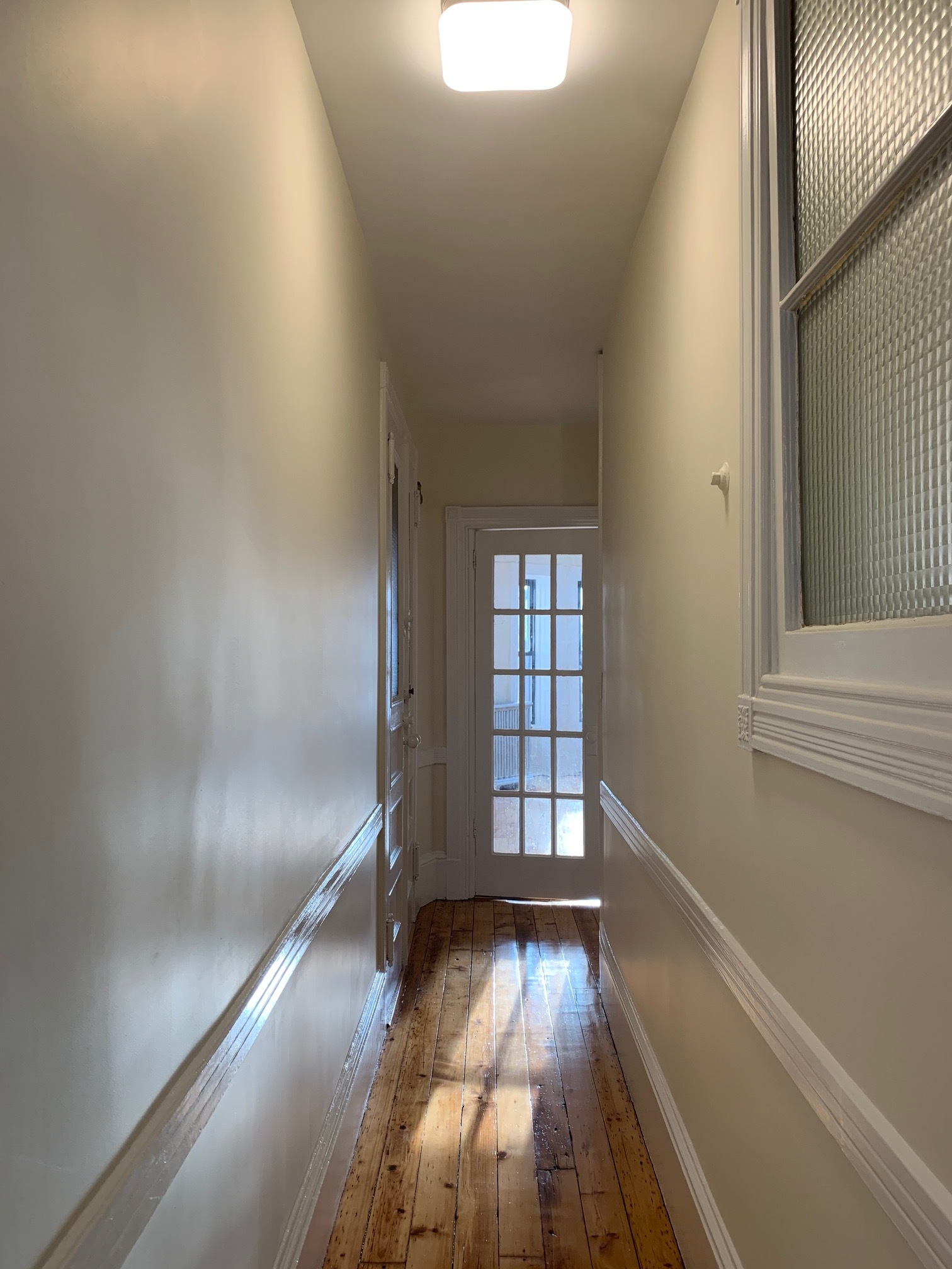 481 9th Street, Unit 4 Brooklyn, NY 11215 - Photo 12 of 33 an empty room with wooden floor and windows