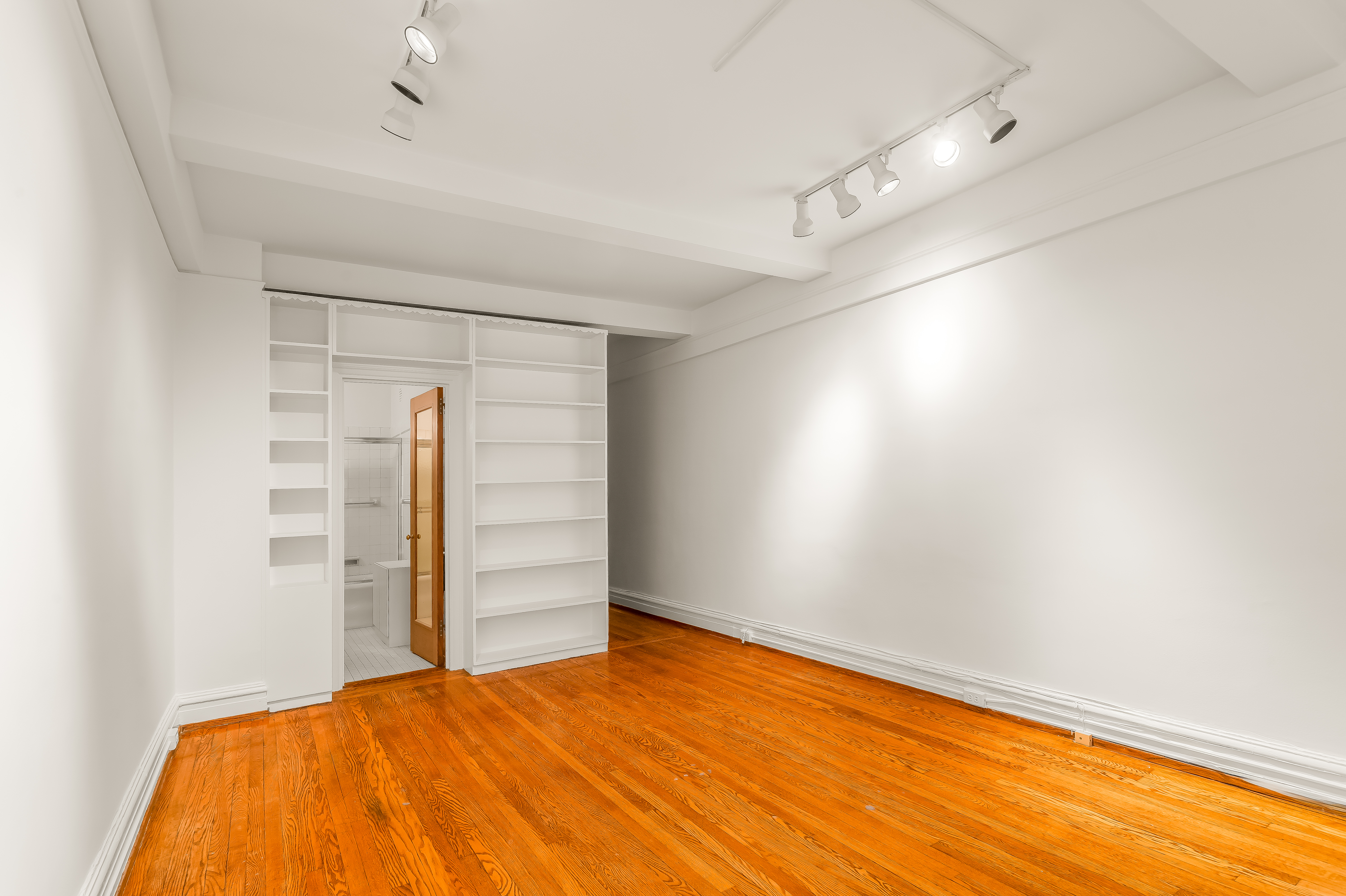 180 East 79th Street, Unit 5A Manhattan, NY 10075 - Photo 13 of 19 a view of empty room with wooden floor