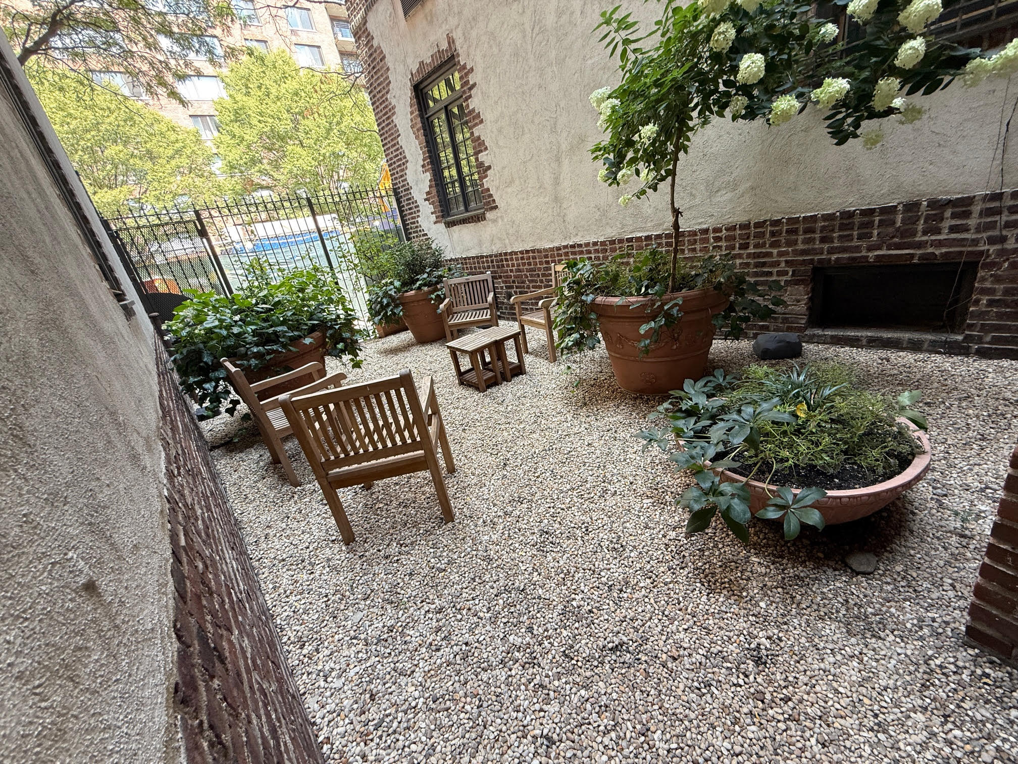 370 Central Park West, Unit 413 Manhattan, NY 10025 - Photo 18 of 19 a view of a backyard with plants and a garden