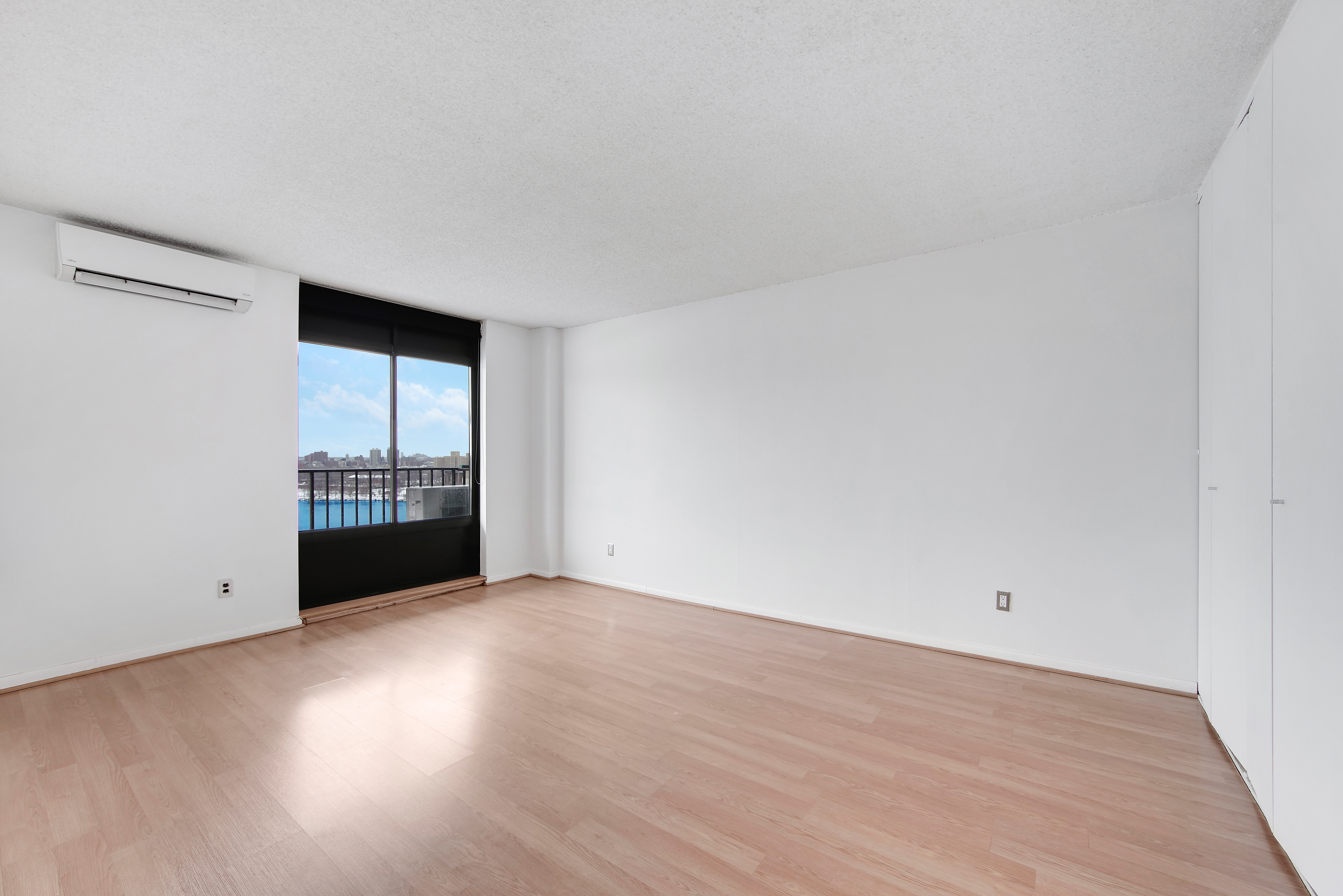 25-40 Shore Boulevard, Unit 15S Queens, NY 11102 - Photo 7 of 21 a view of an empty room and window