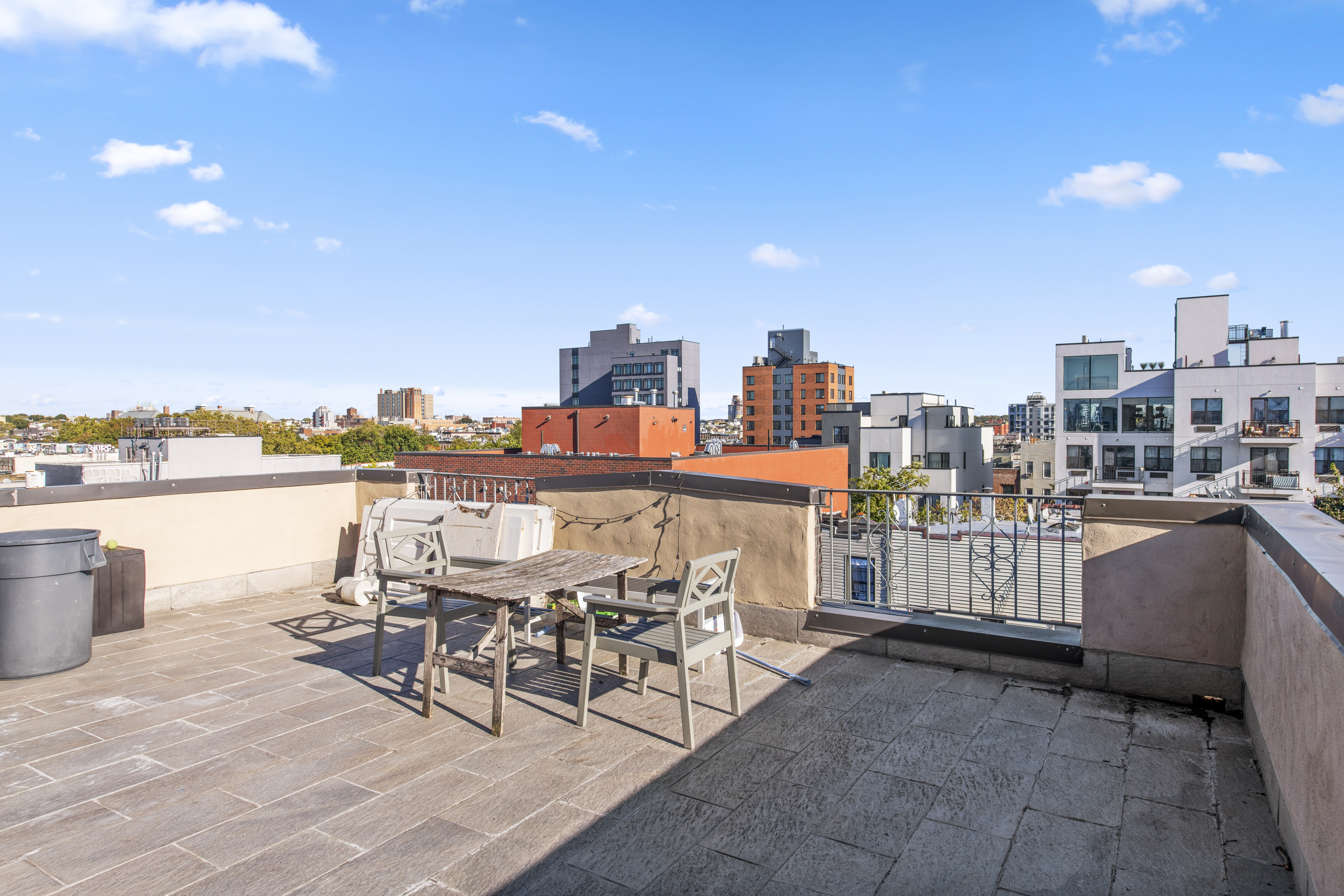 221 Troutman Street, Unit 4L Brooklyn, NY 11237 - Photo 3 of 11 a view of a terrace with furniture and city view