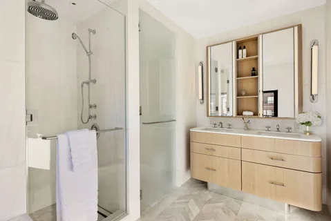 a bathroom with a double vanity sink mirror and double
