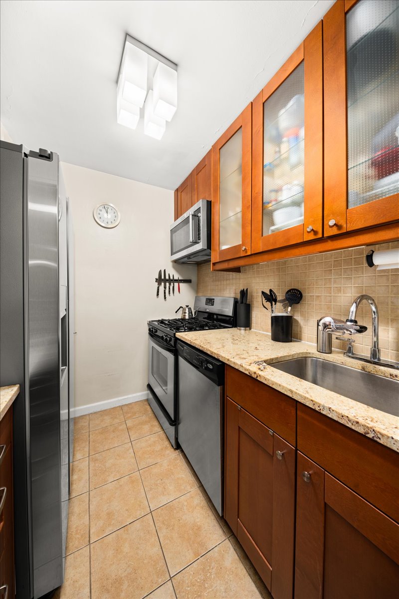 350 Ocean Parkway, Unit 3C Brooklyn, NY 11218 - Photo 5 of 10 a kitchen with stainless steel appliances granite countertop a refrigerator and a sink