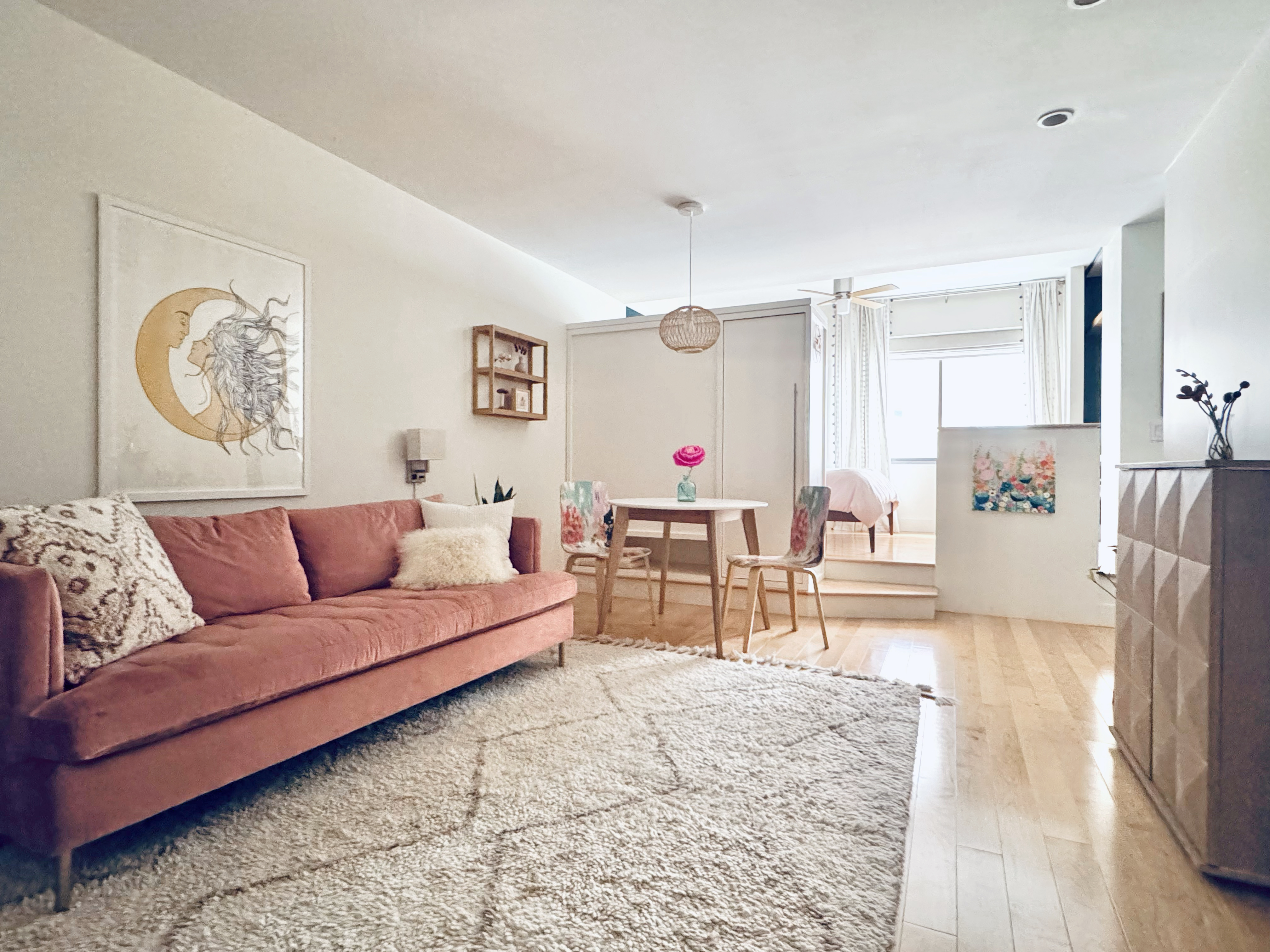 85 8th Avenue, Unit 5-H Manhattan, NY 10011 - Photo 1 of 11 a living room with furniture and a table