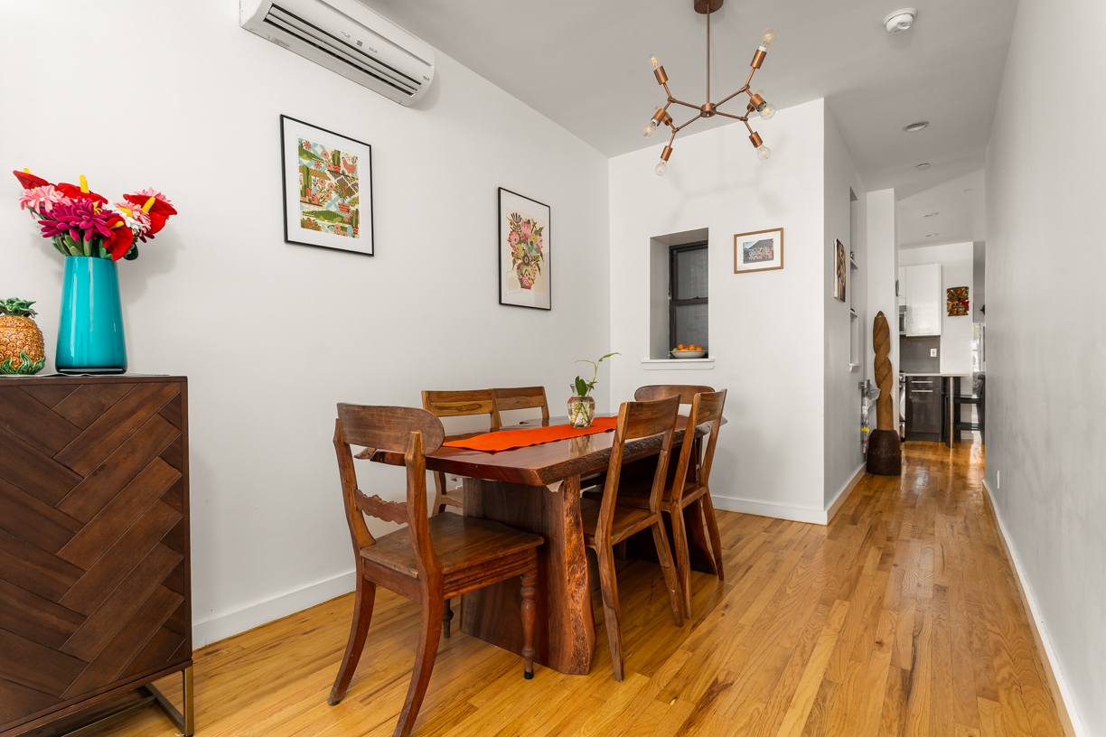 119 East 101st Street, Unit 1A Manhattan, NY 10029 - Photo 3 of 10 a view of a dining room with furniture and wooden floor