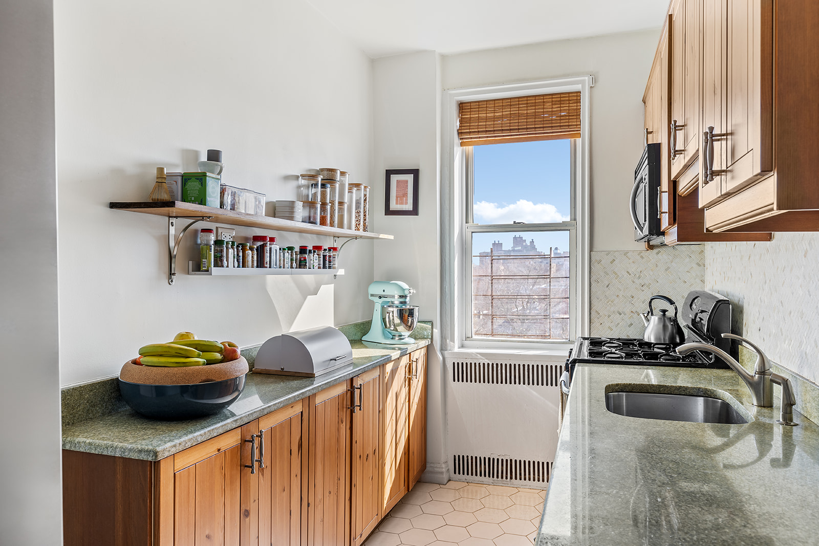 140 East 2nd Street, Unit 5B Brooklyn, NY 11218 - Photo 5 of 7 a kitchen with stainless steel appliances a sink a stove and a refrigerator
