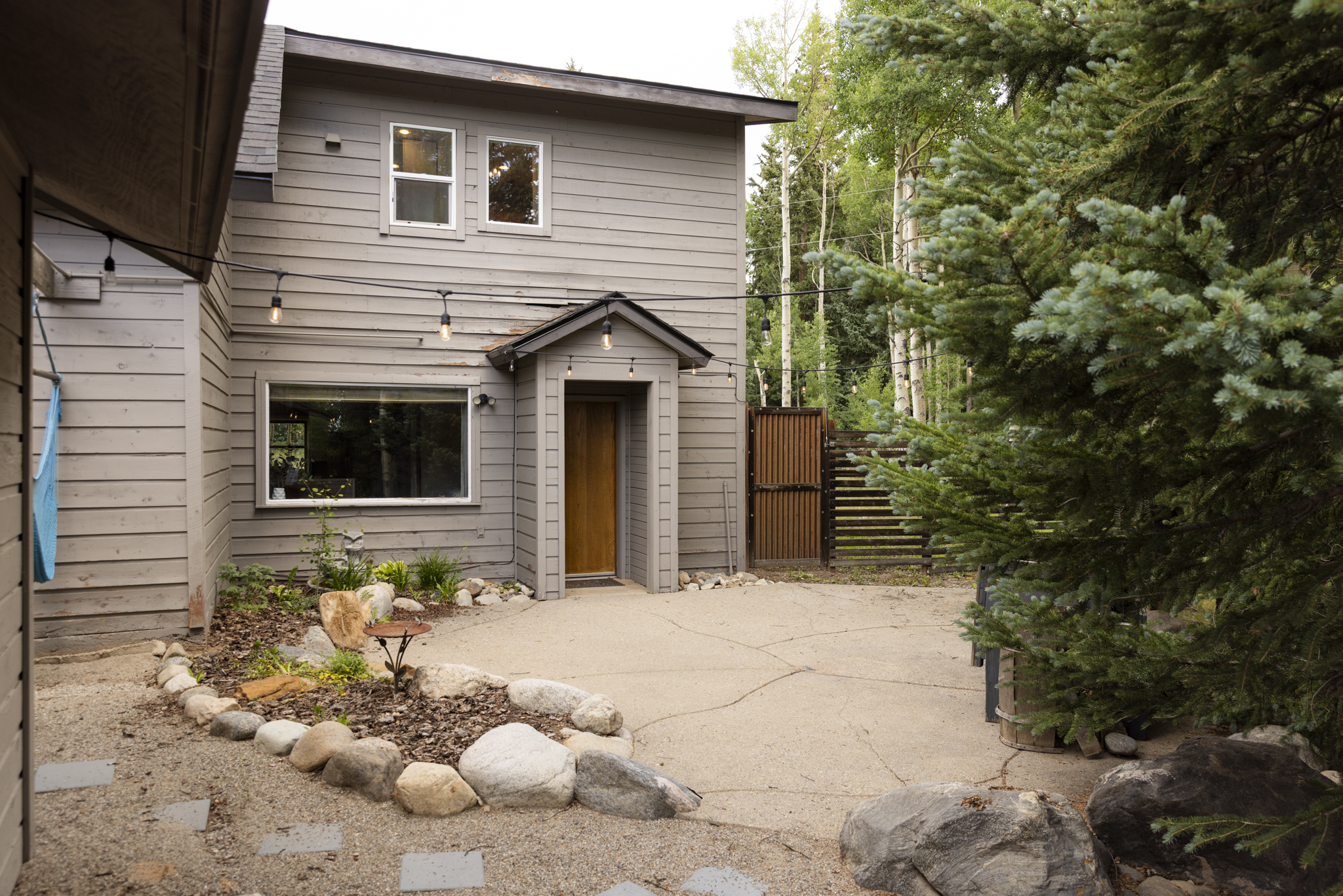 133 Gold Run Road Alma, CO 80420 - Photo 35 of 46 a front view of a house with a large tree and a yard