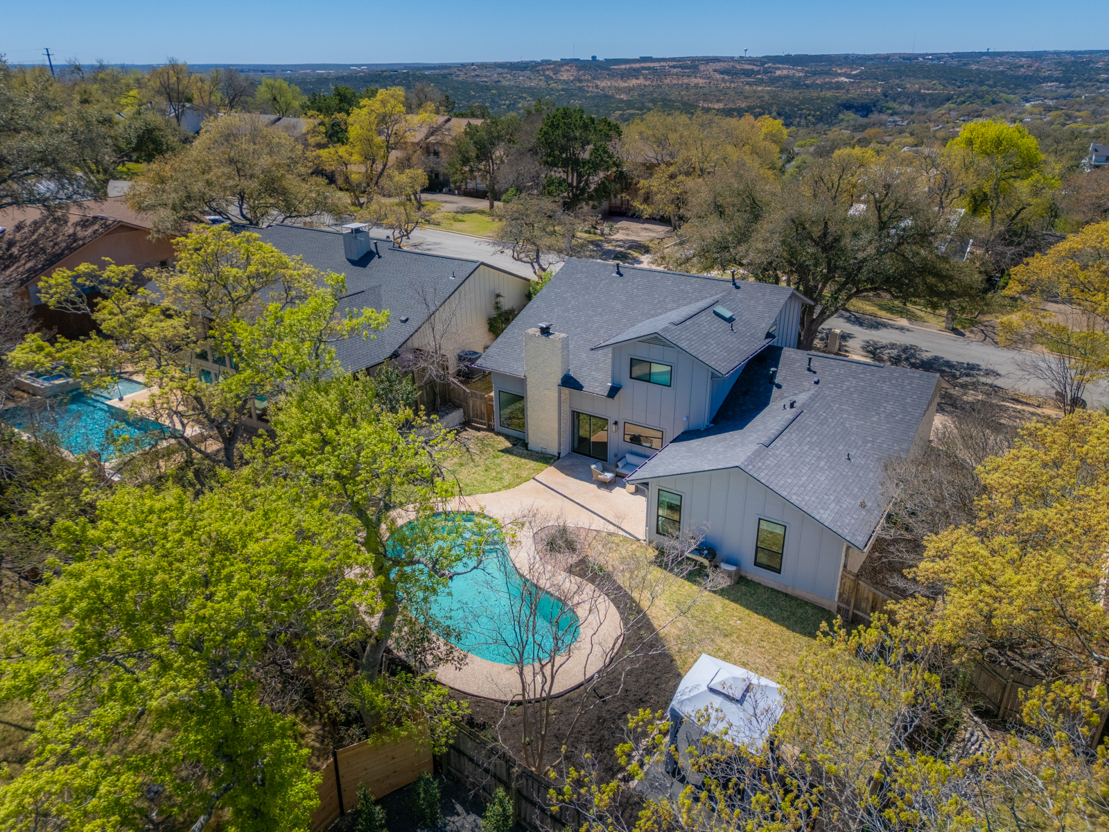 1317 Thaddeus Cove Austin, TX 78746 - Photo 21 of 22 an aerial view of a house with yard swimming pool and outdoor seating
