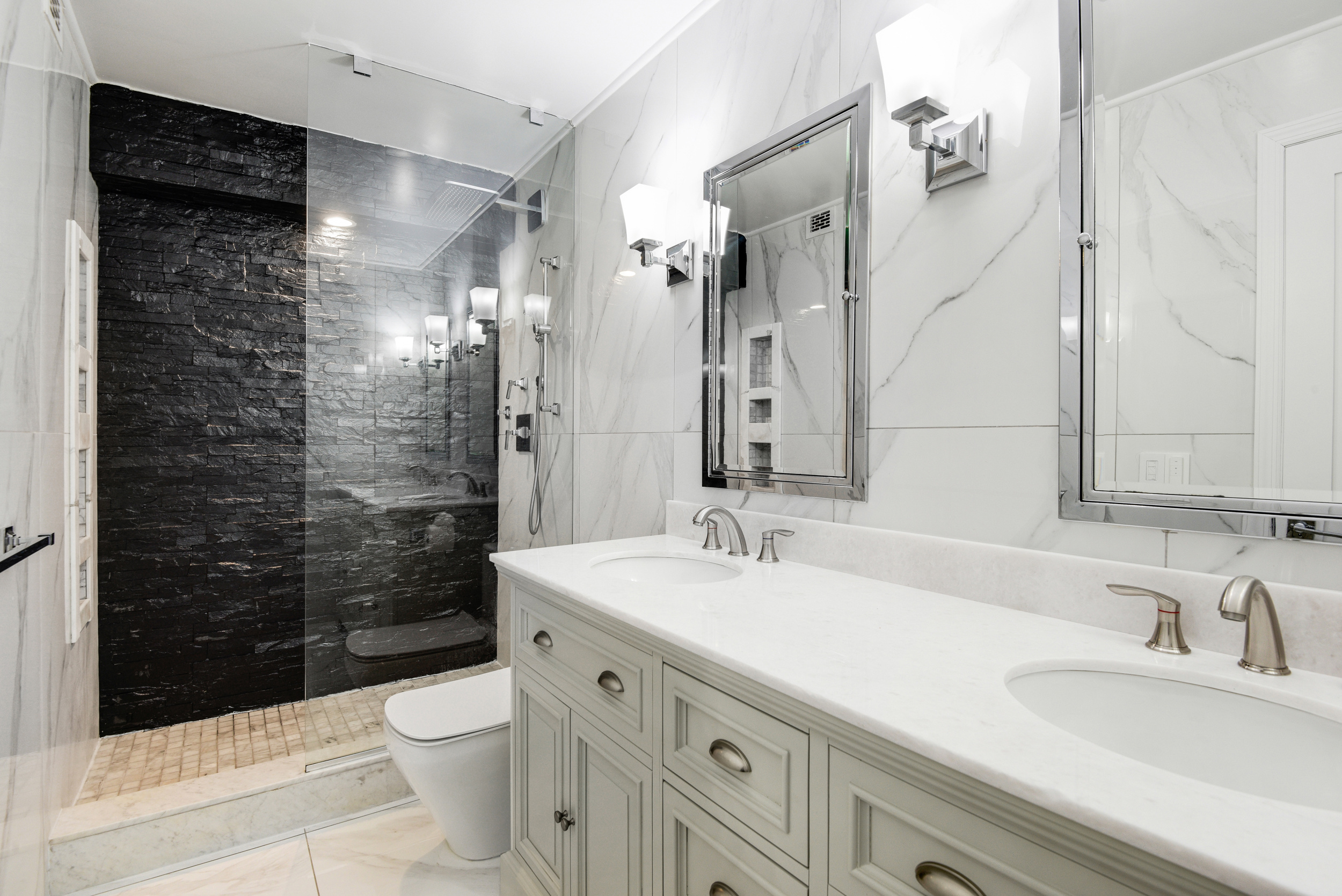 400 East 70th Street, Unit 3005 Manhattan, NY 10021 - Photo 9 of 18 a bathroom with a sink a toilet and shower