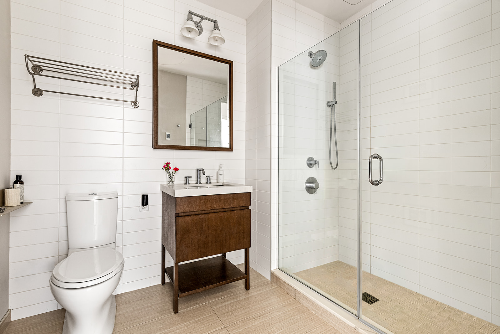 500 Waverly Avenue Brooklyn, NY 11238 - Photo 5 of 13 a bathroom with a toilet sink vanity and shower