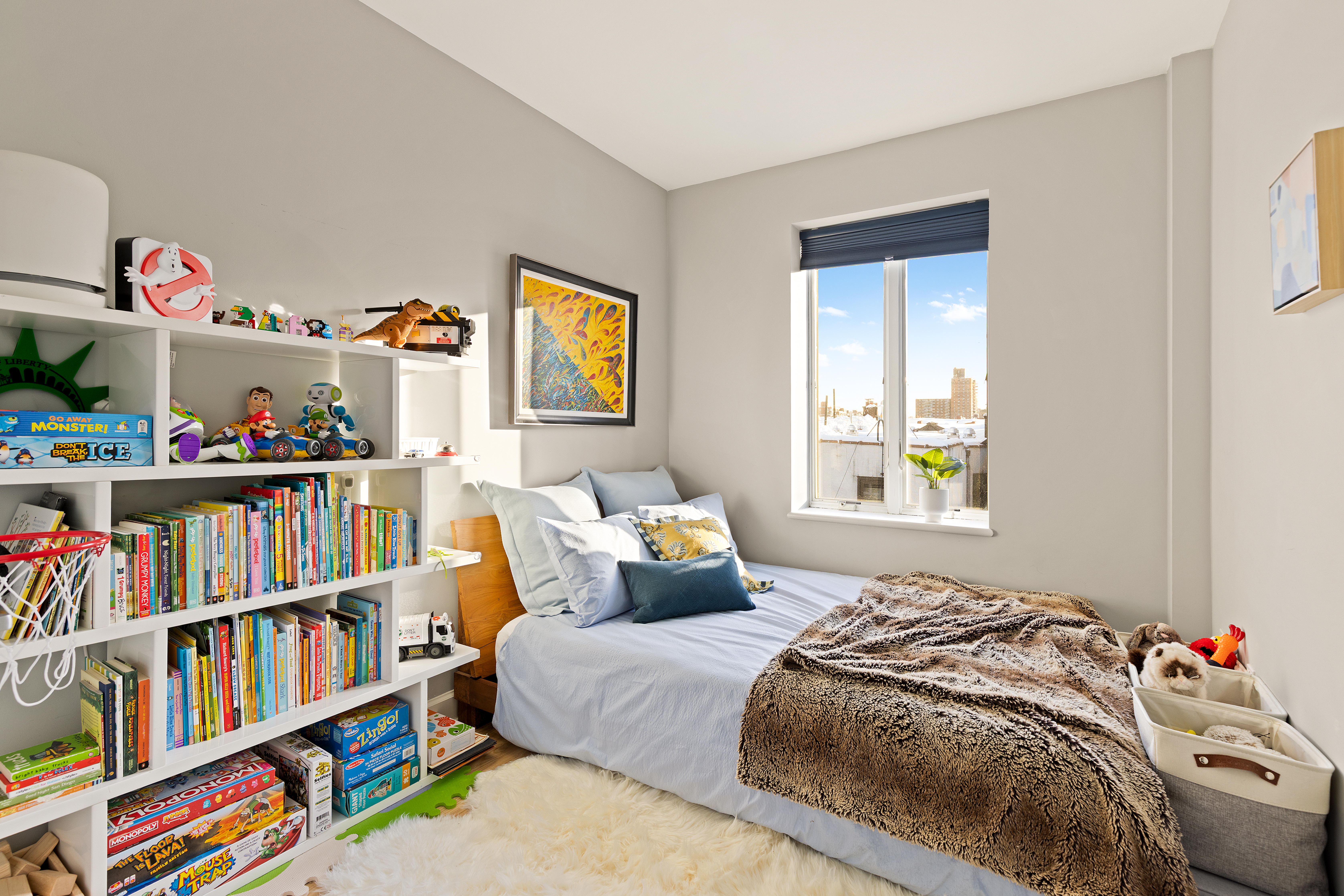 316 2nd Street, Unit 5E Brooklyn, NY 11215 - Photo 9 of 11 a bedroom with a bed and a book shelf