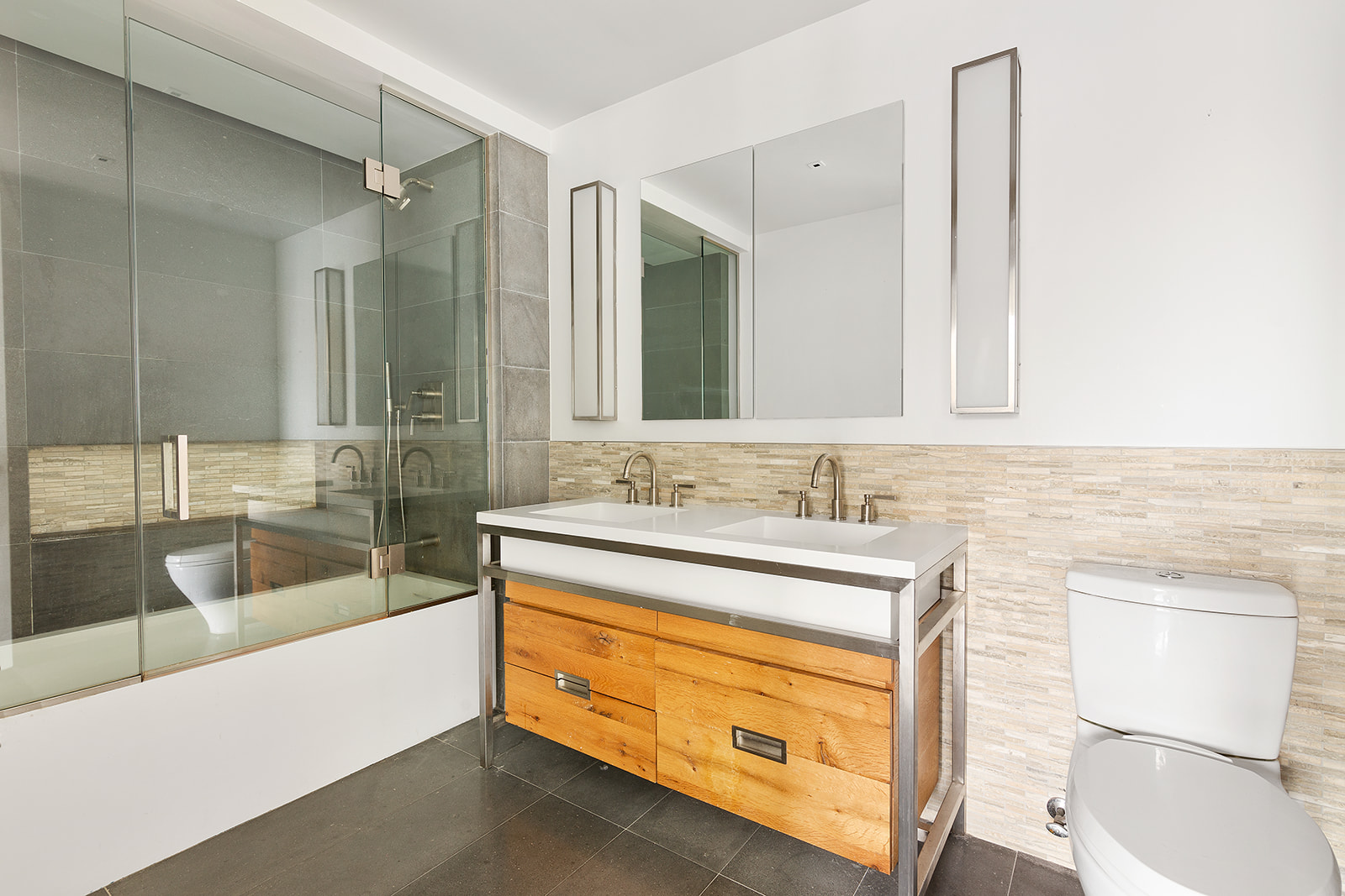 211 East 13th Street, Unit PH1B Manhattan, NY 10003 - Photo 4 of 8 a bathroom with a sink and a bathtub