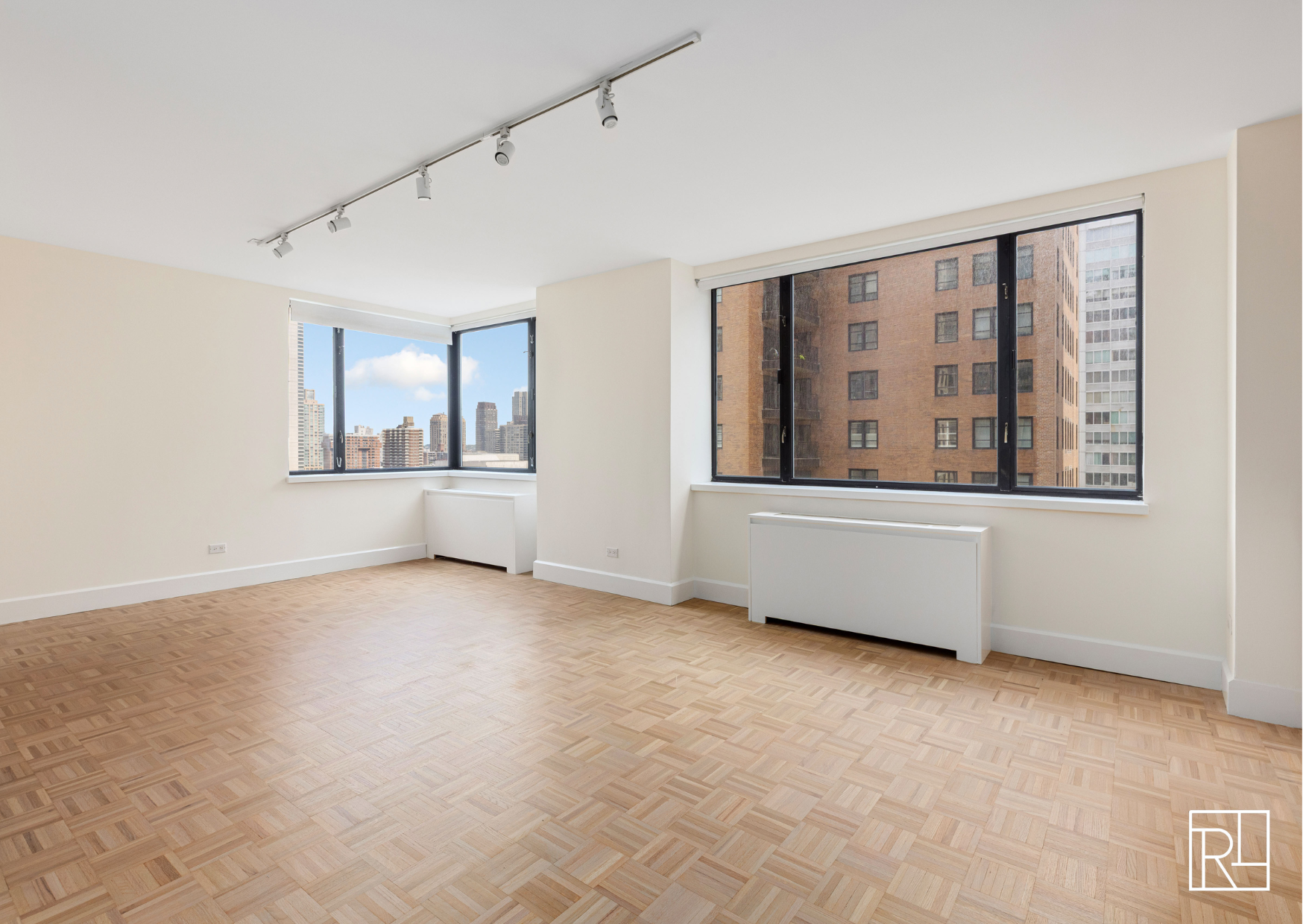30 West 61st Street, Unit 16D Manhattan, NY 10023 - Photo 2 of 12 an empty room with windows and closet