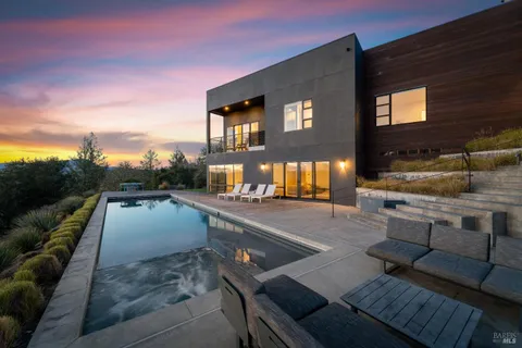 a view of a living room and a balcony