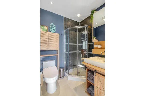 a bathroom with a toilet sink and a shower