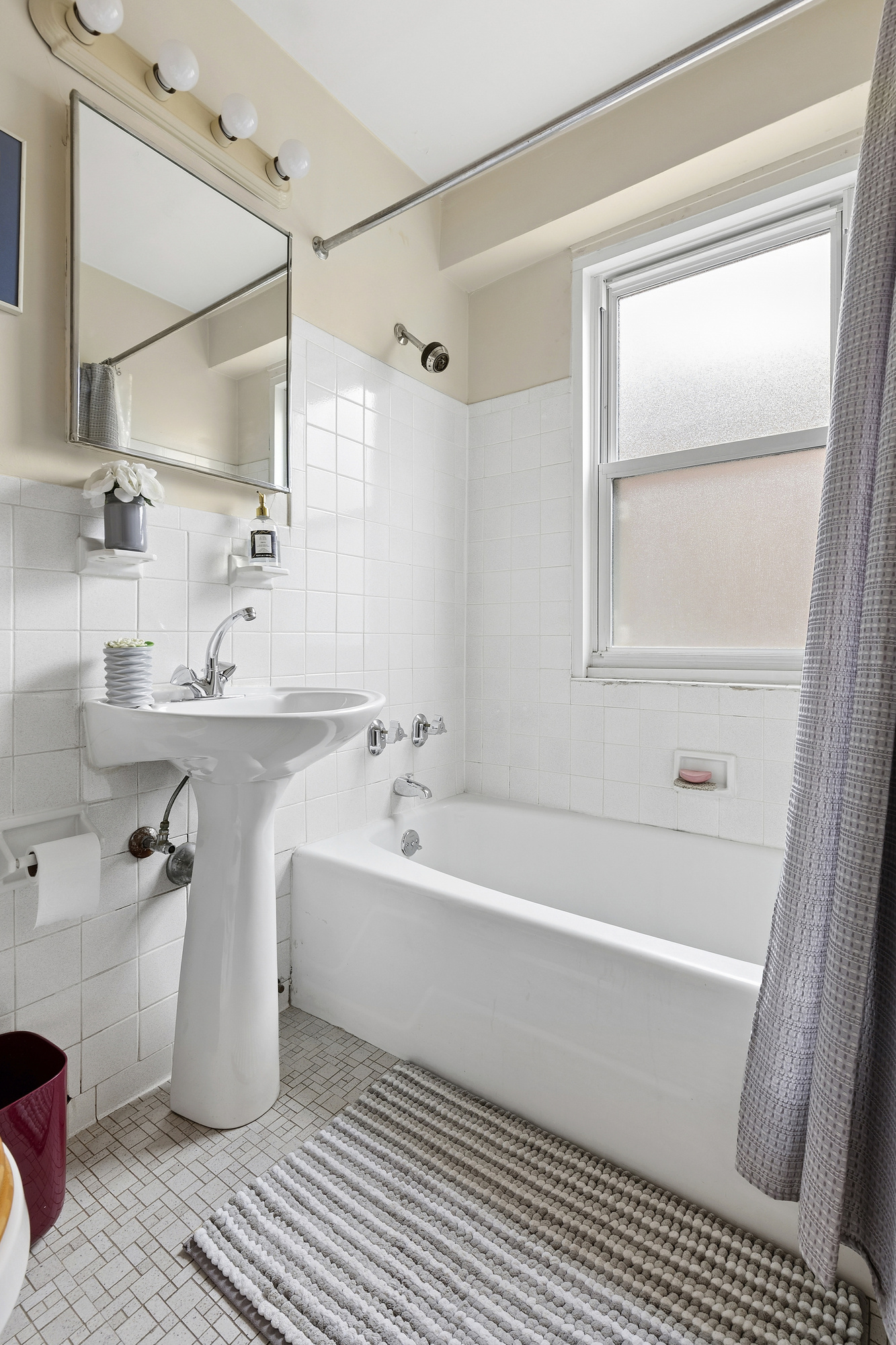 101 West 12th Street, Unit 15JK Manhattan, NY 10011 - Photo 17 of 22 a bathroom with a sink a toilet and shower