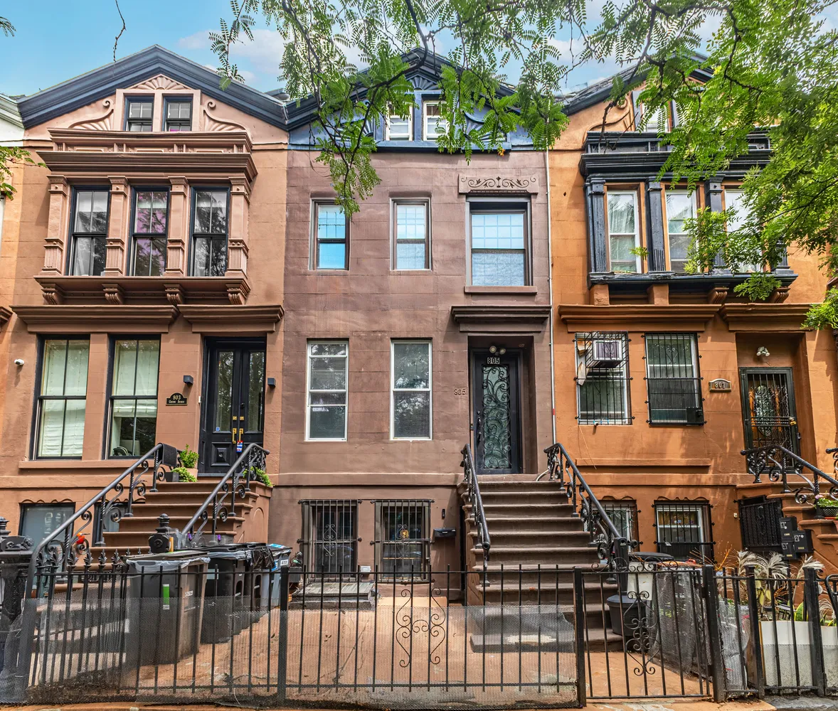 a front view of a residential apartment building with a door