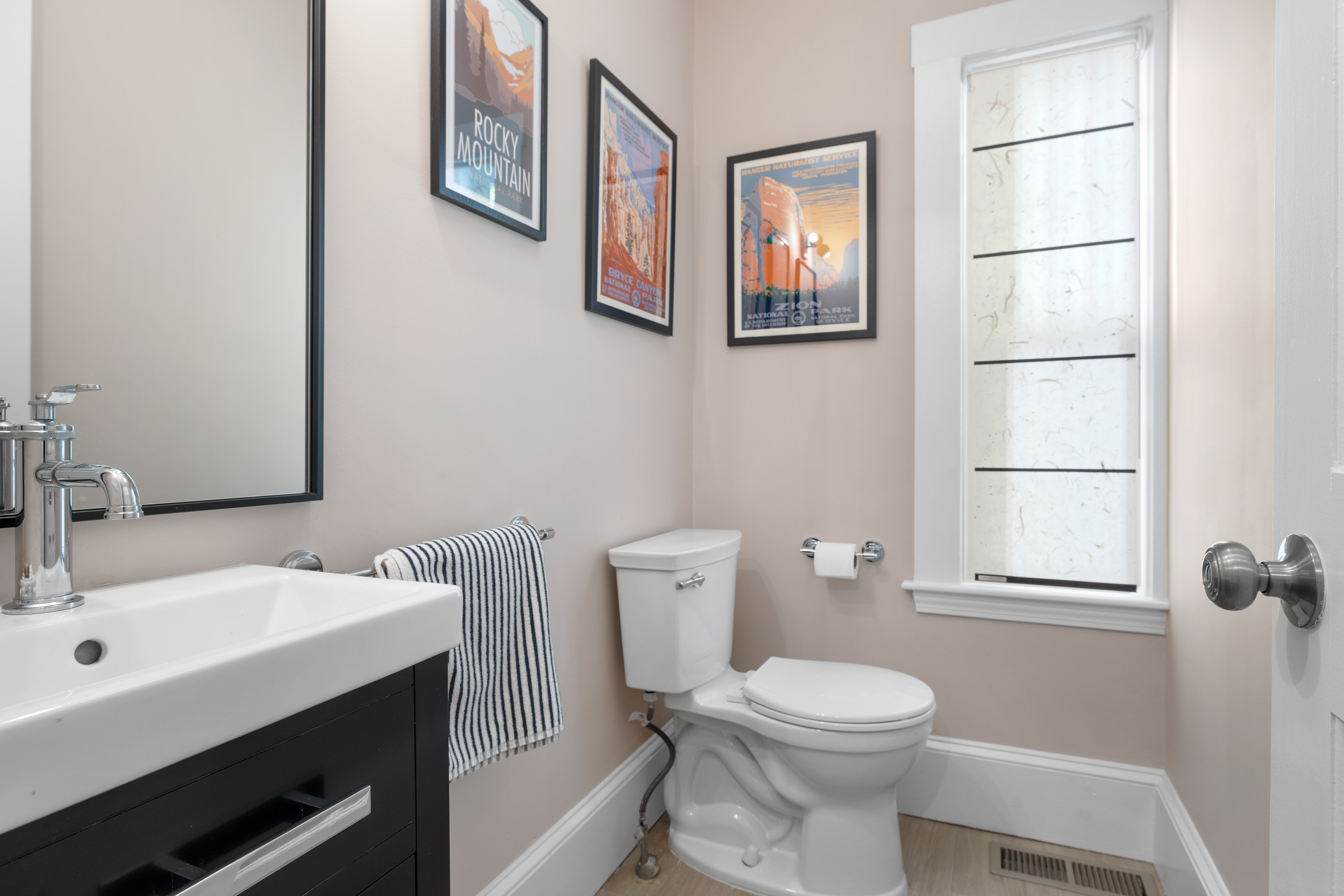 90 Maple Place Dedham, MA 02026 - Photo 16 of 40 a bathroom with a toilet a sink and mirror