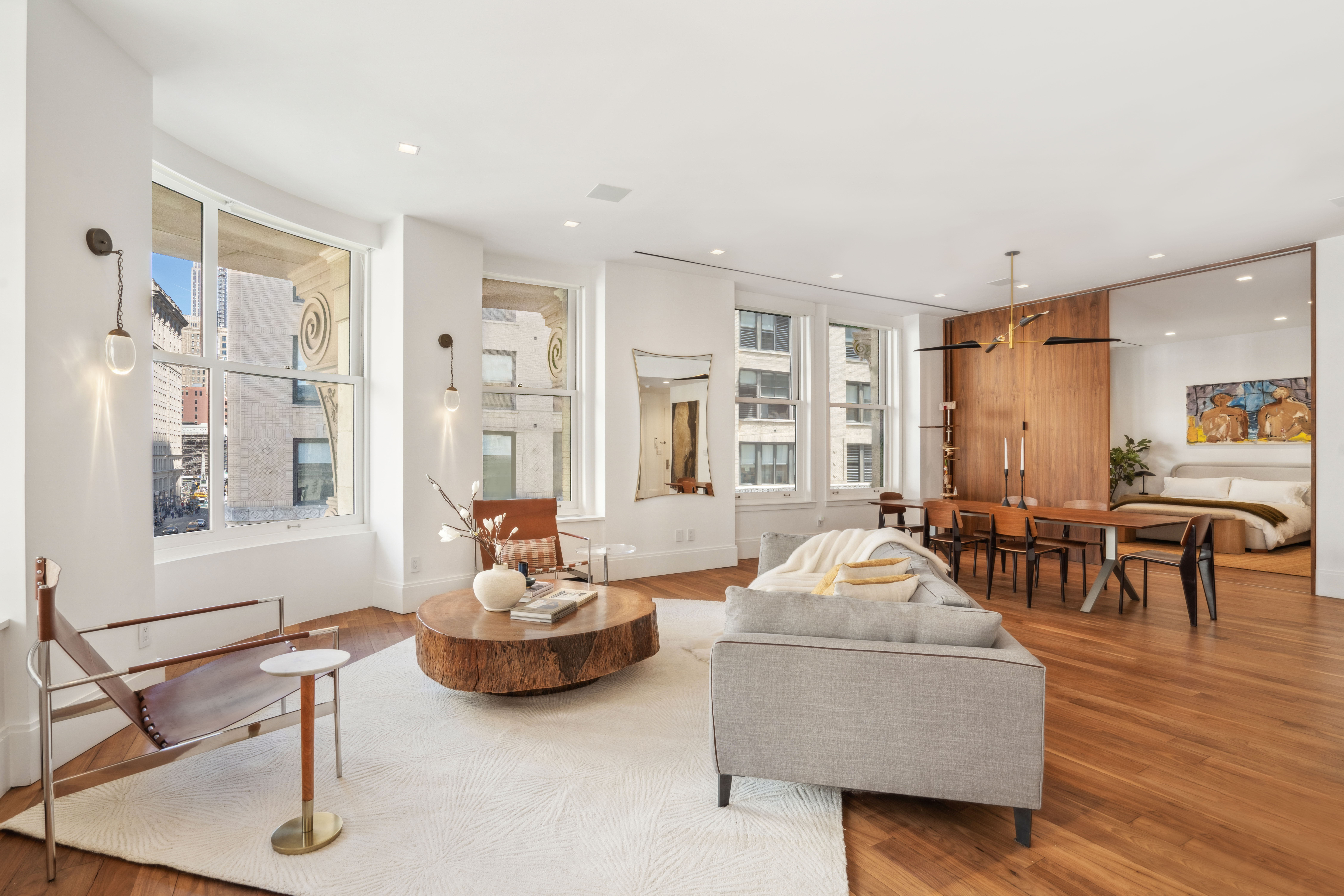 141 5th Avenue, Unit 4C Manhattan, NY 10010 - Photo 10 of 16 a living room with furniture and wooden floor