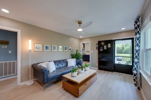 a kitchen with a sink cabinets and window