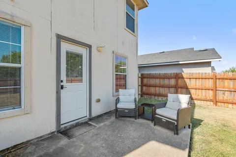 a view of a house with backyard and a garden