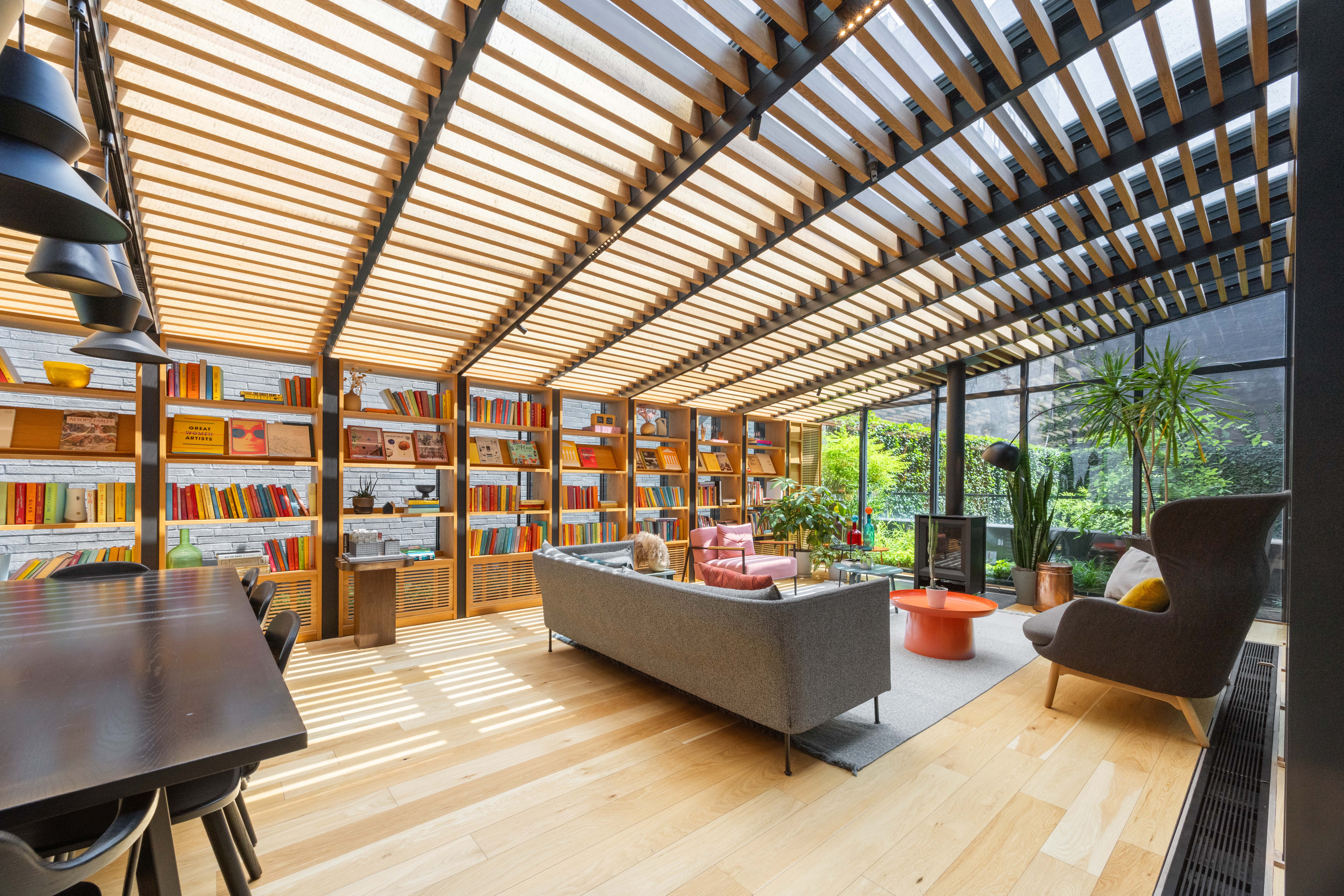 547 West 47th Street, Unit 509 Manhattan, NY 10036 - Photo 14 of 29 a living room filled with furniture and a large window