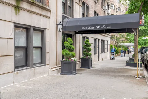 a view of a house with a potted plant and a window