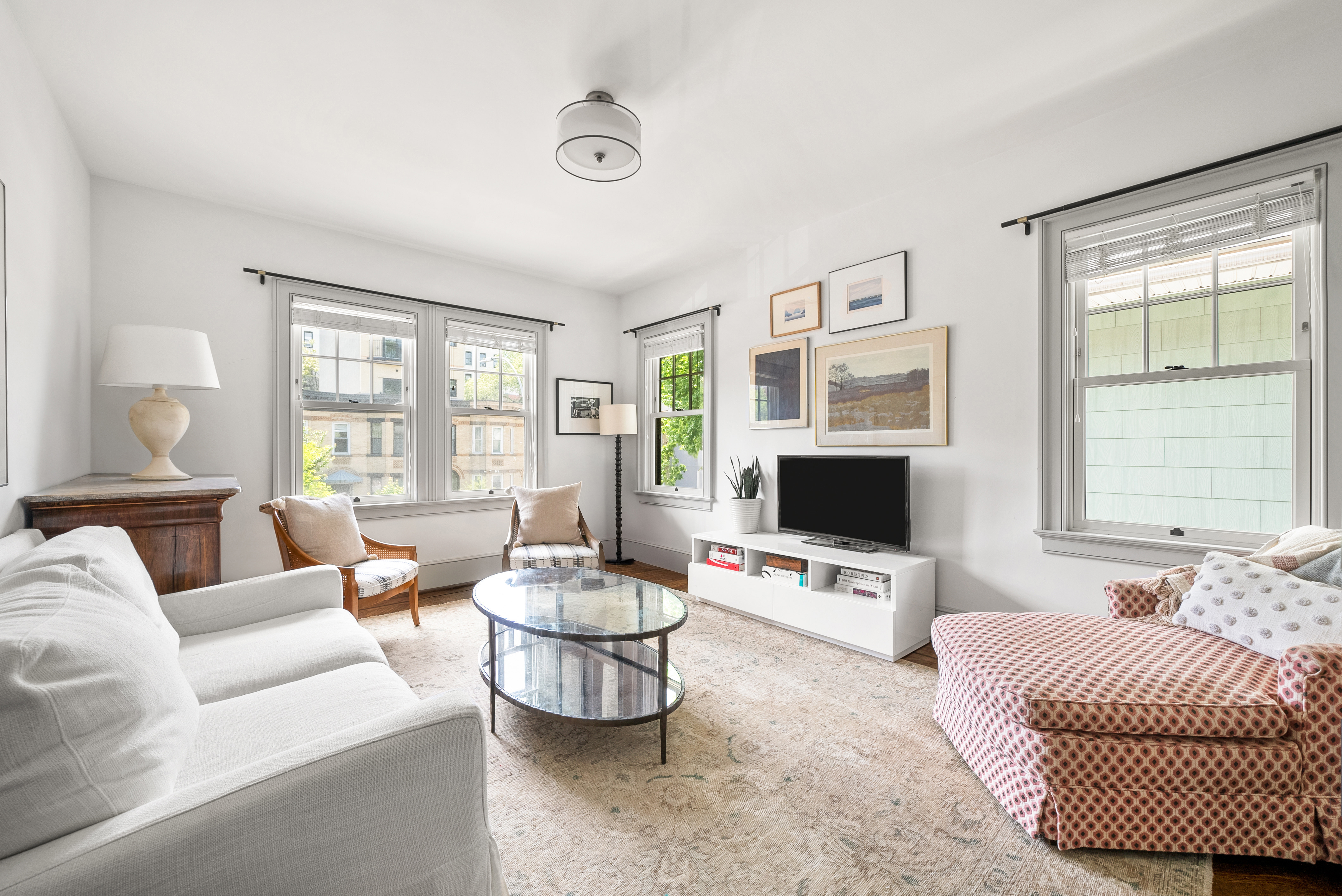 a living room with furniture and a flat screen tv