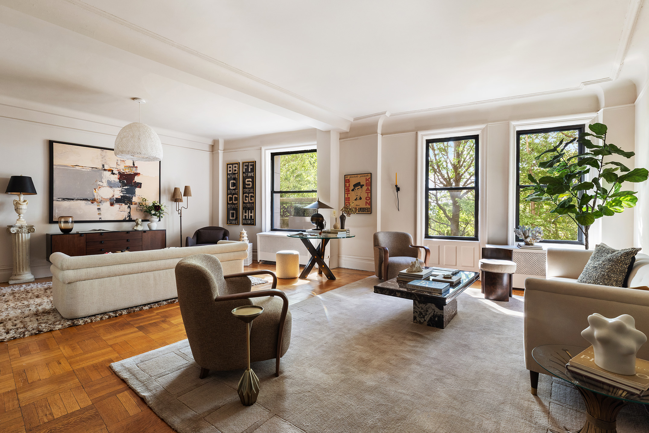 270 Riverside Drive, Unit 2C Manhattan, NY 10025 - Photo 2 of 22 a living room with furniture and a large window