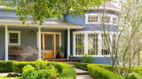 front view of a house with a yard
