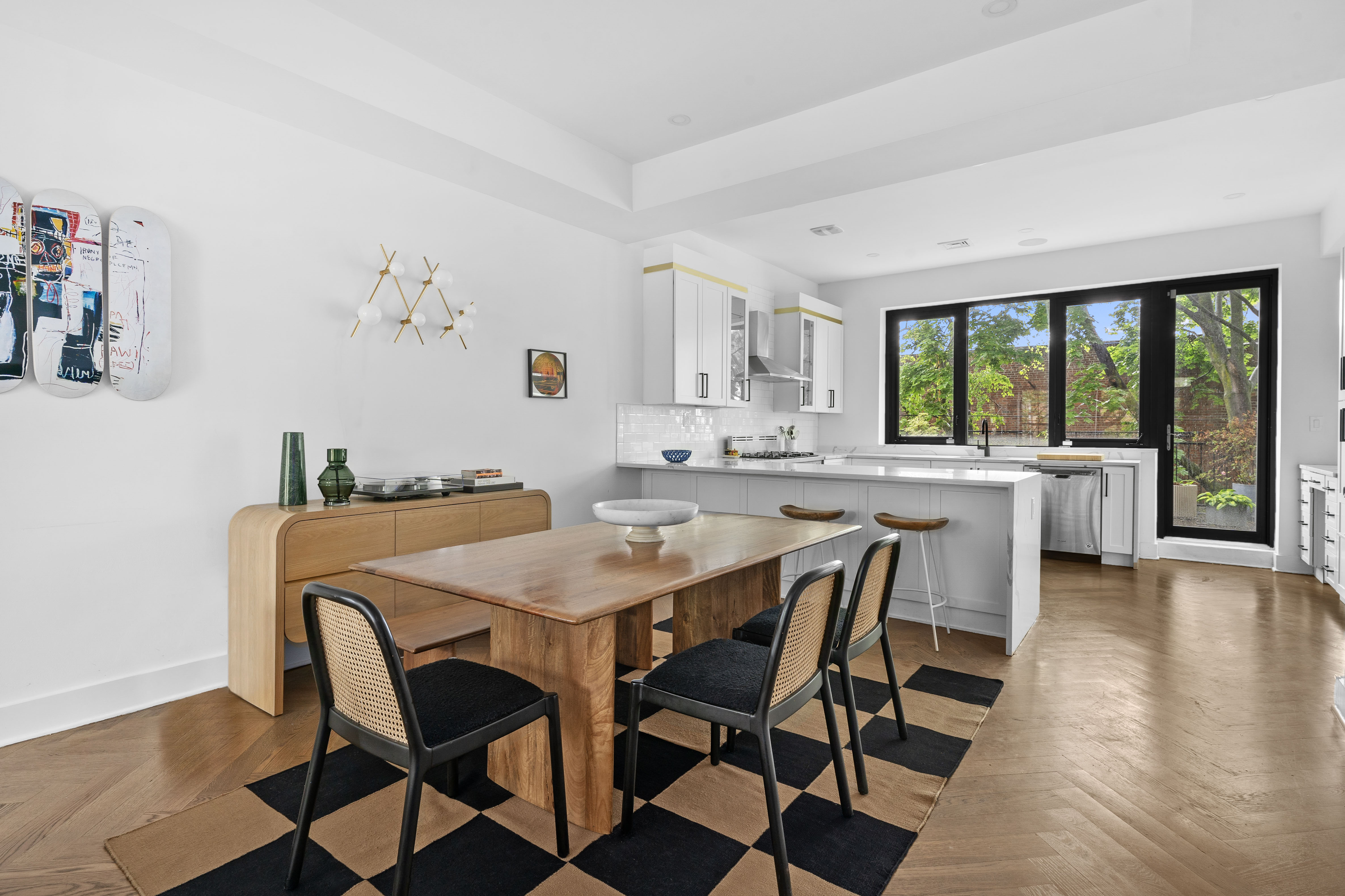 1591 Pacific Street Brooklyn, NY 11213 - Photo 2 of 16 a dining room with furniture and a large window