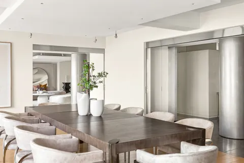 a dining room with furniture and wooden floor