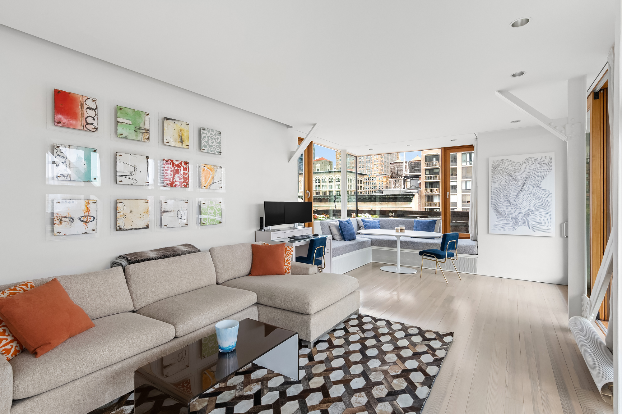 105 East 29th Street, Unit 12PH Manhattan, NY 10016 - Photo 20 of 24 a living room with furniture and a couch