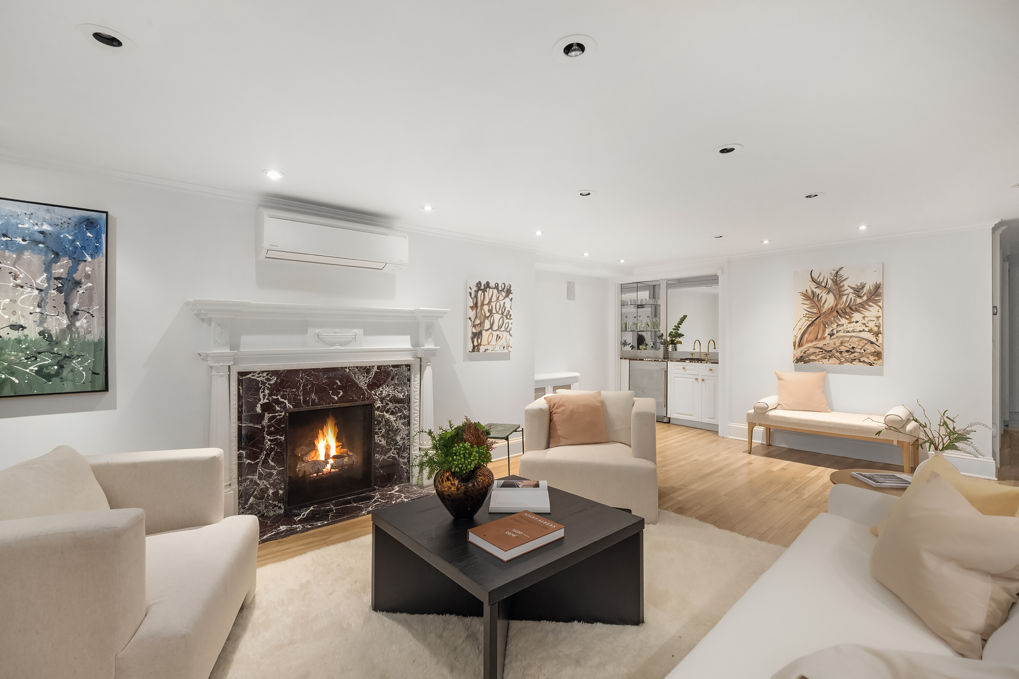 112 West 13th Street Manhattan, NY 10011 - Photo 41 of 46 a living room with furniture and a fireplace