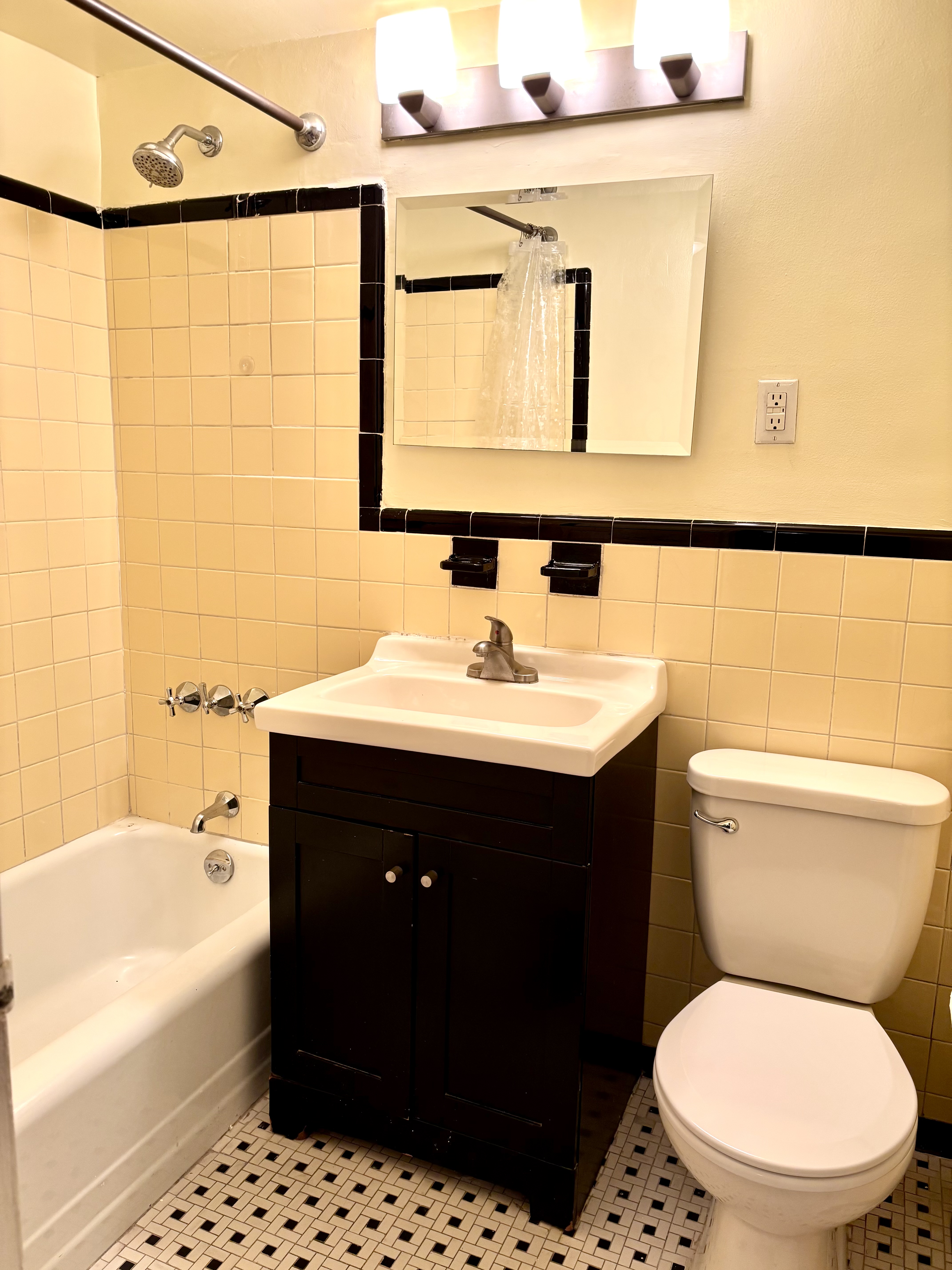 1270 5th Avenue, Unit 3B Manhattan, NY 10029 - Photo 4 of 7 a bathroom with a sink vanity mirror and toilet